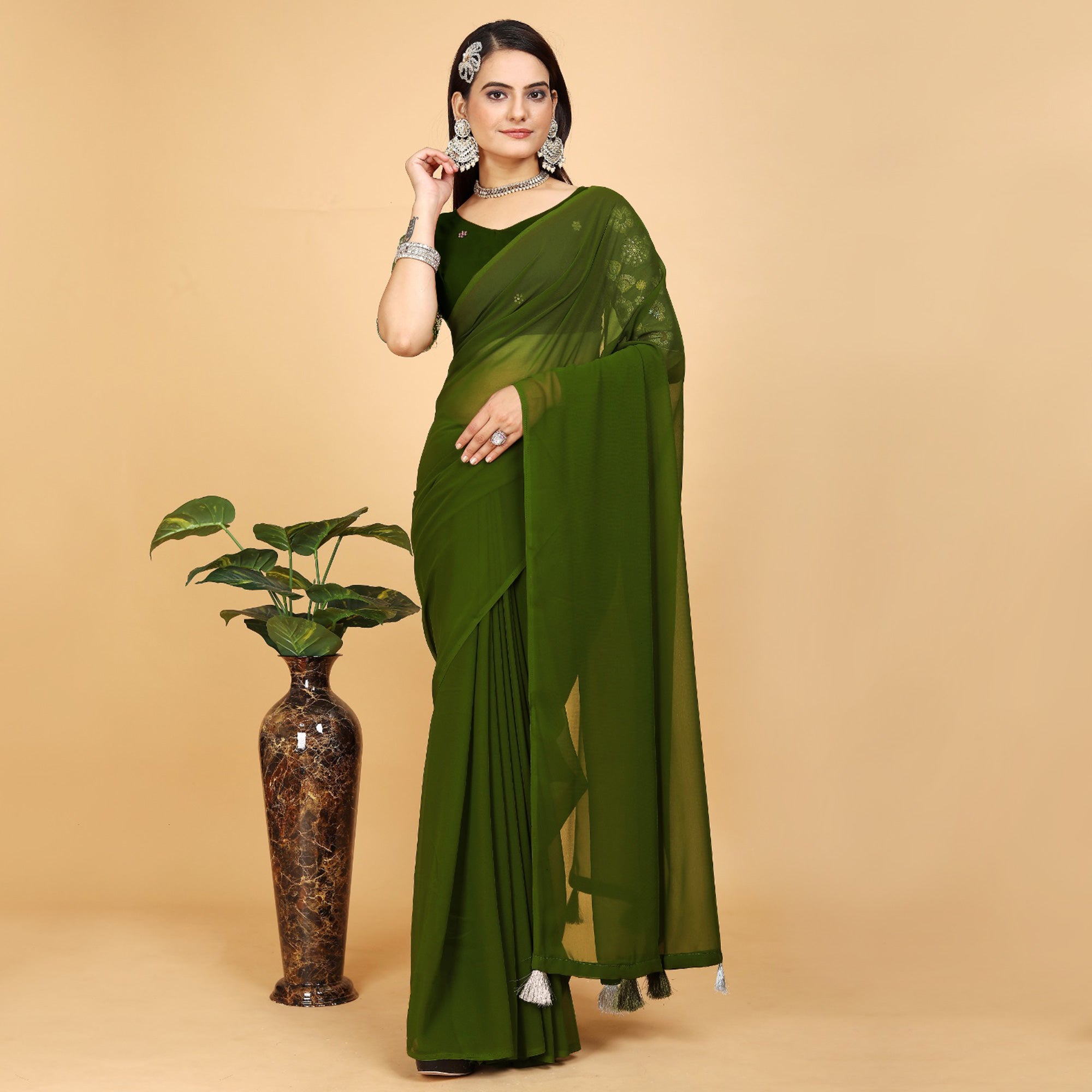 Green Solid Georgette Saree With Tassels