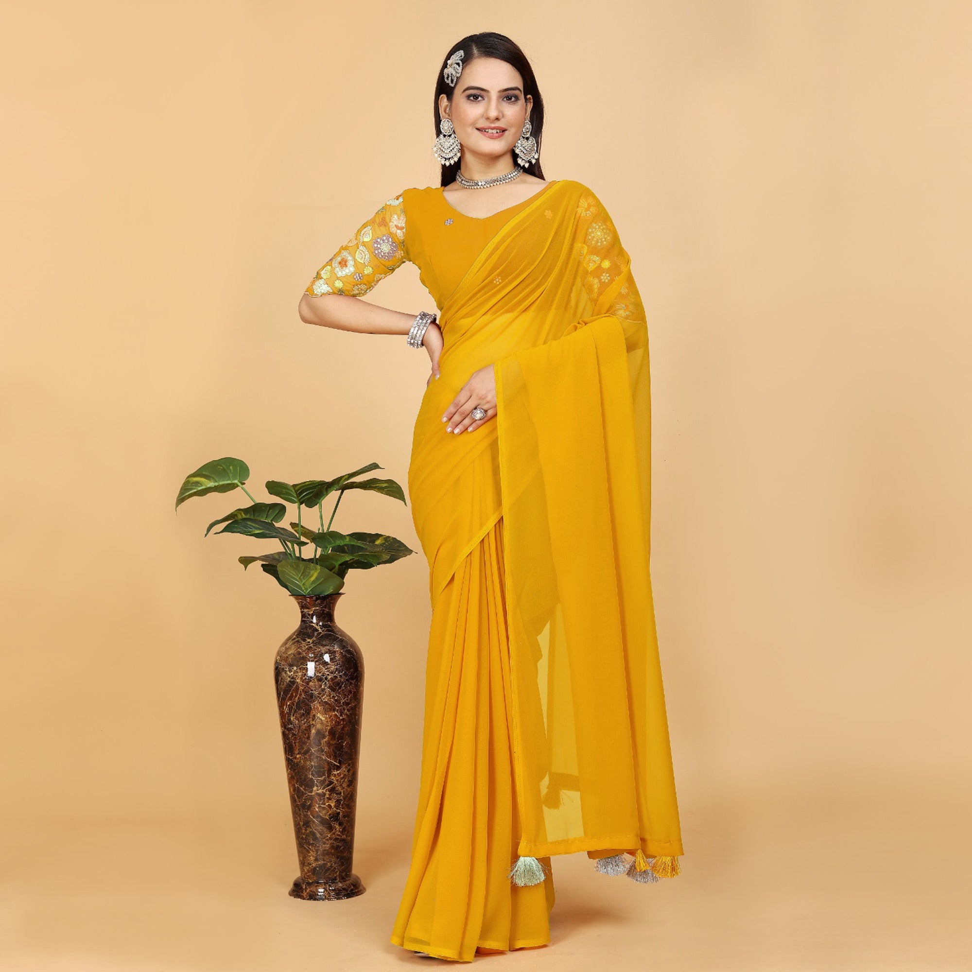 Yellow Solid Georgette Saree With Tassels