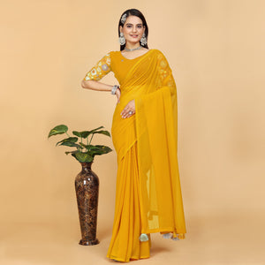 Yellow Solid Georgette Saree With Tassels