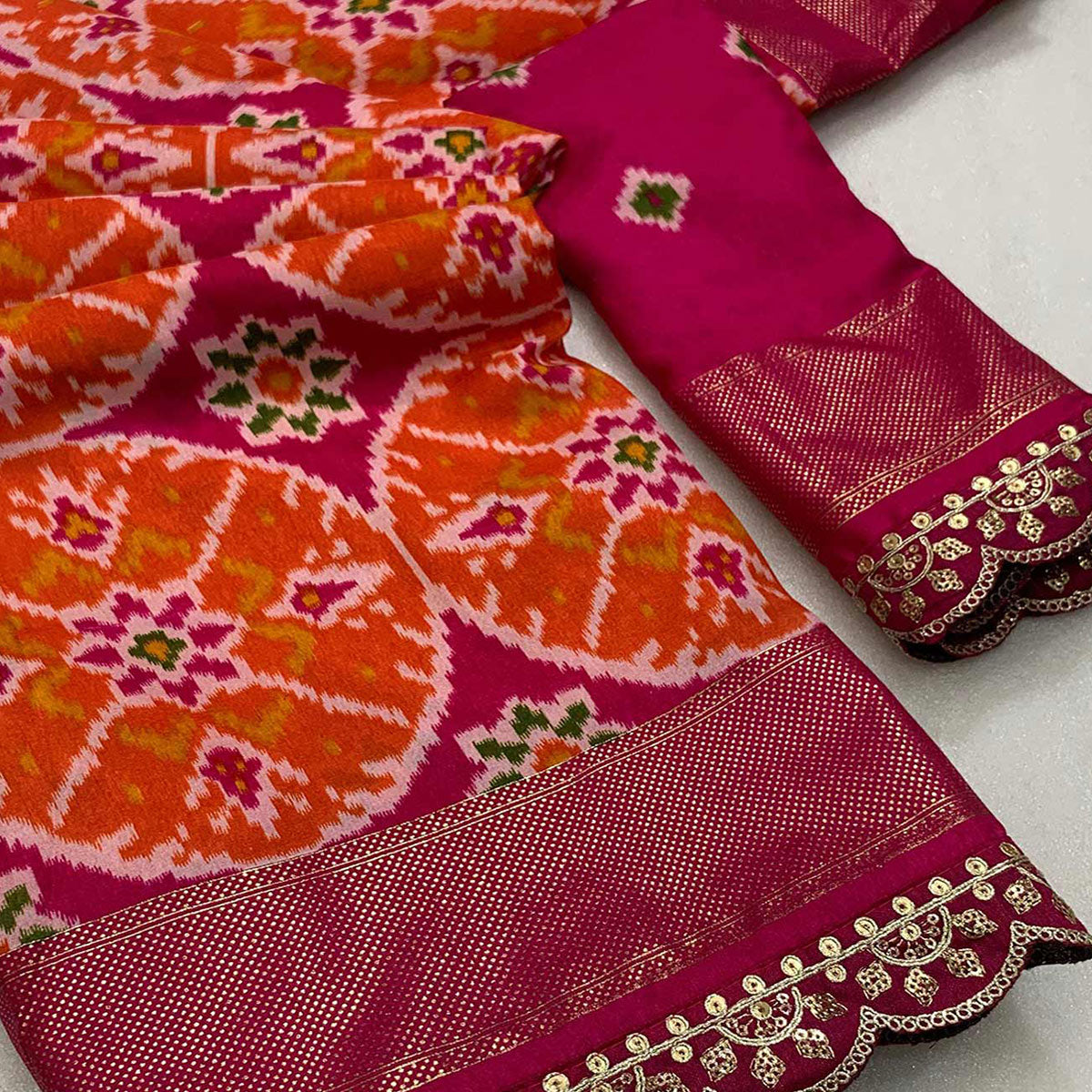 Pink & Orange Ikkat Printed Dola Silk Saree With Sequins Embroidery Border