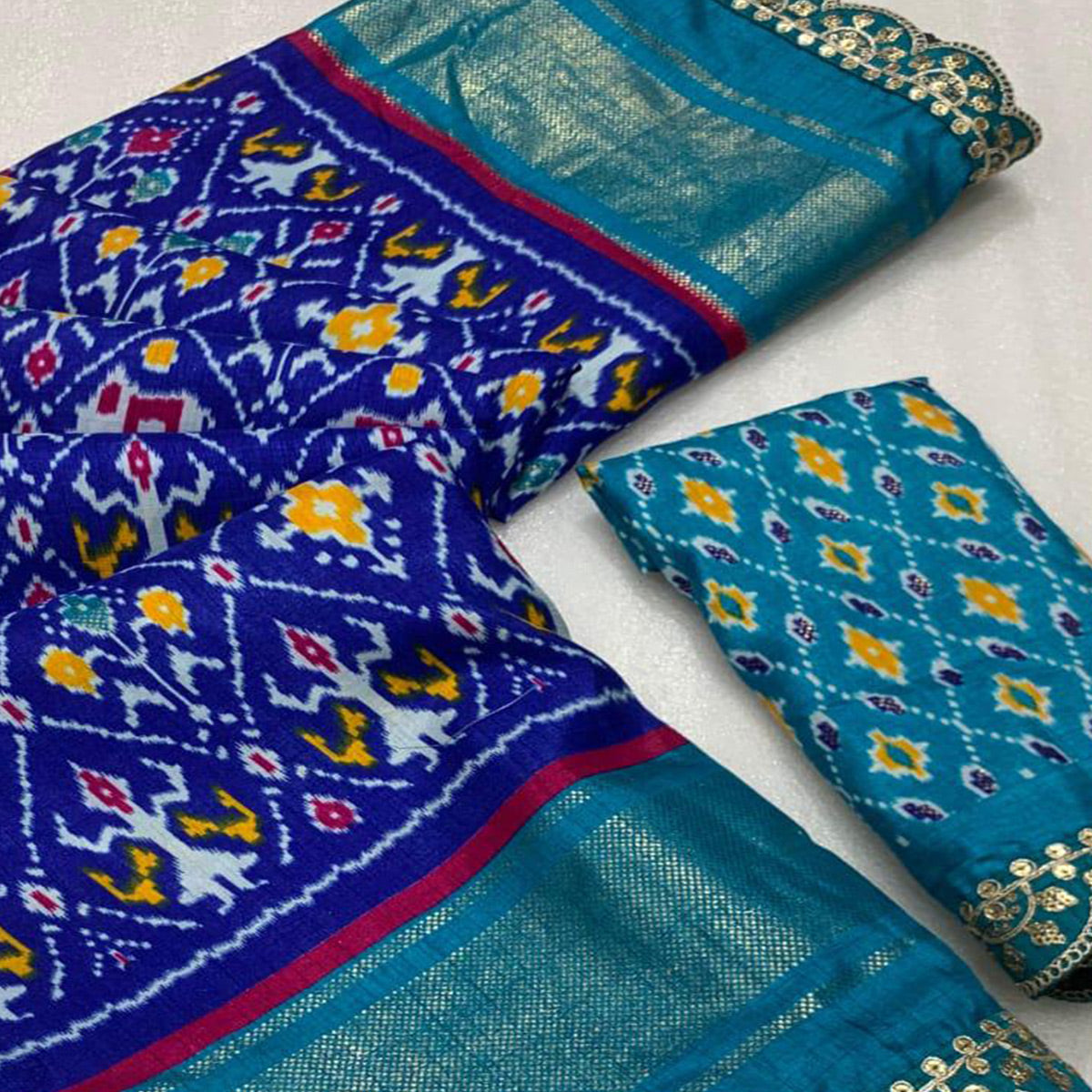 Blue Ikkat Printed Dola Silk Saree With Sequins Embroidered Border