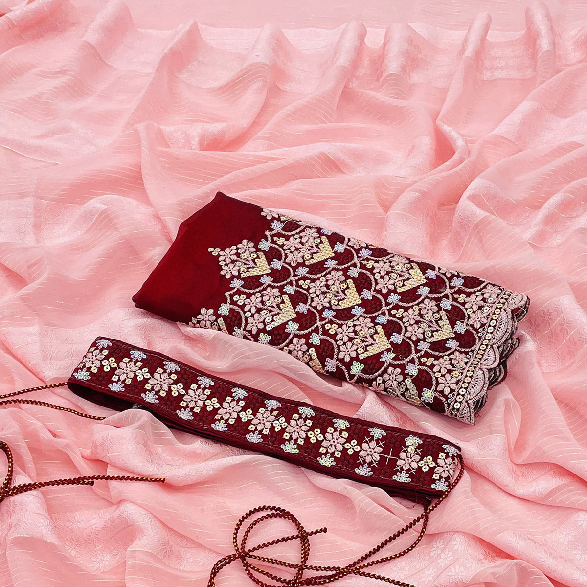 Light Gajari Pink Zari Woven Georgette Saree With Tassels