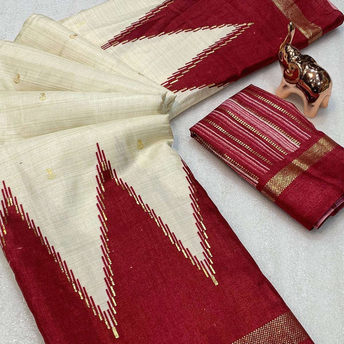 Subtle & Stylish Cream Saree With Ikkat Prints In Luxe Dola Silk For Festive Wear