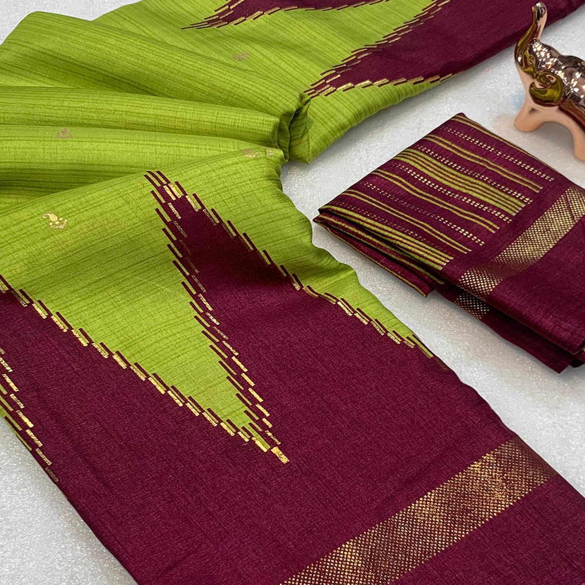 Subtle and Stylish Green Saree with Ikkat Prints in Luxe Dola Silk for Festive Wear