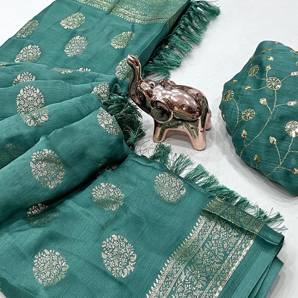 Elegant Dusty Teal Foil Floral Printed Georgette Saree With Tassel Detailing Pallu