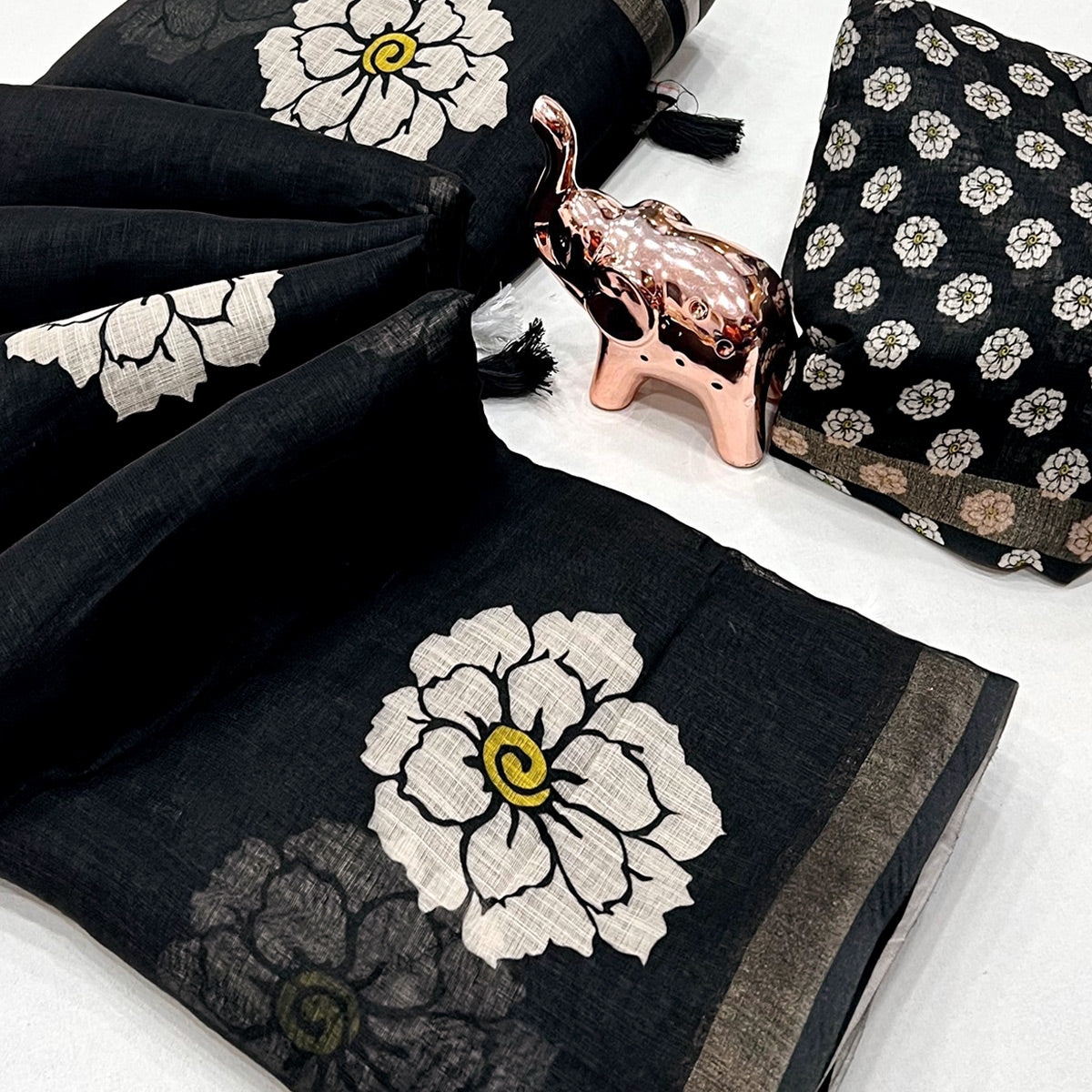 Graceful Black Floral Printed Saree in Linen Silk with Delicate Tassel Accents