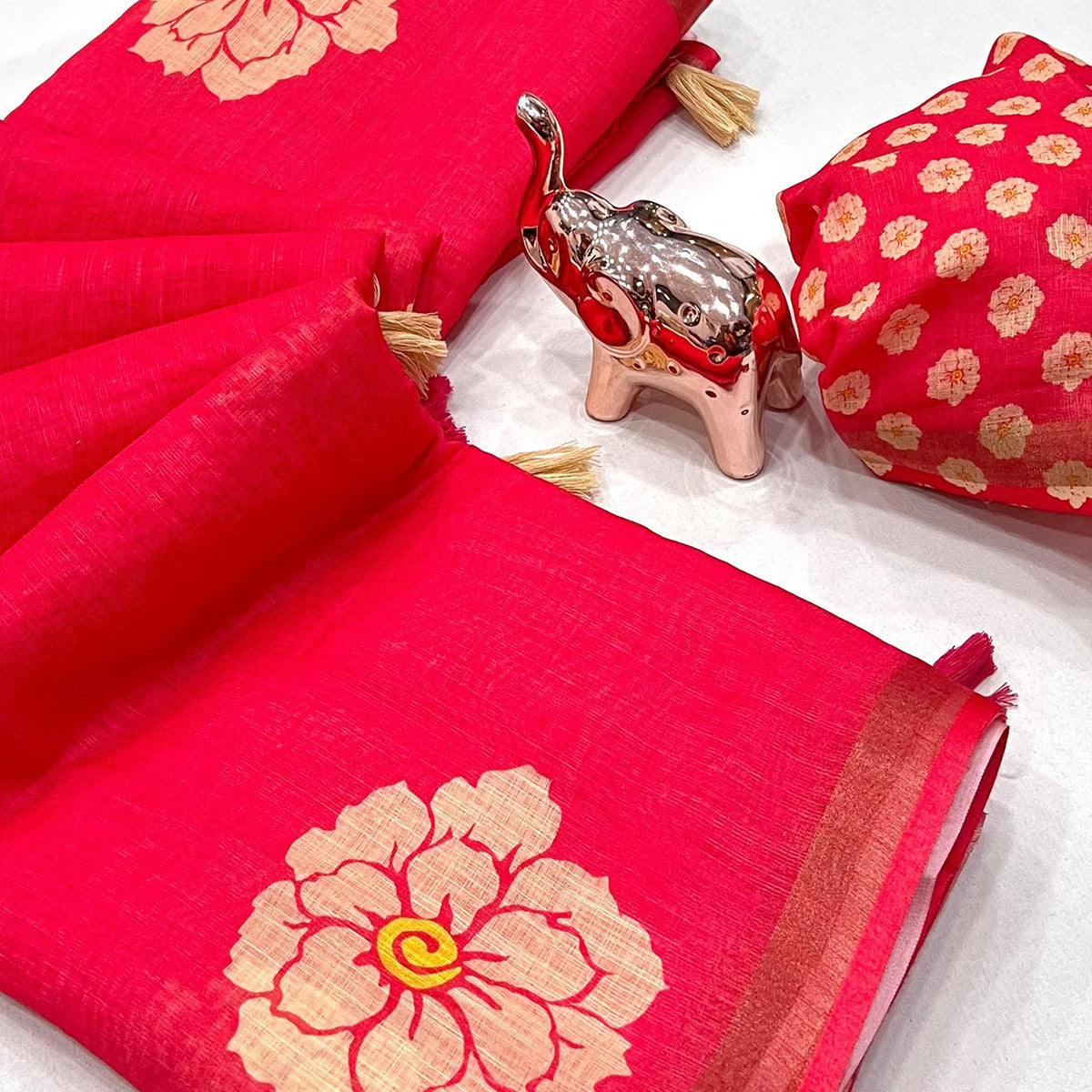 Graceful Pink Floral Printed Saree in Linen Silk with Delicate Tassel Accents