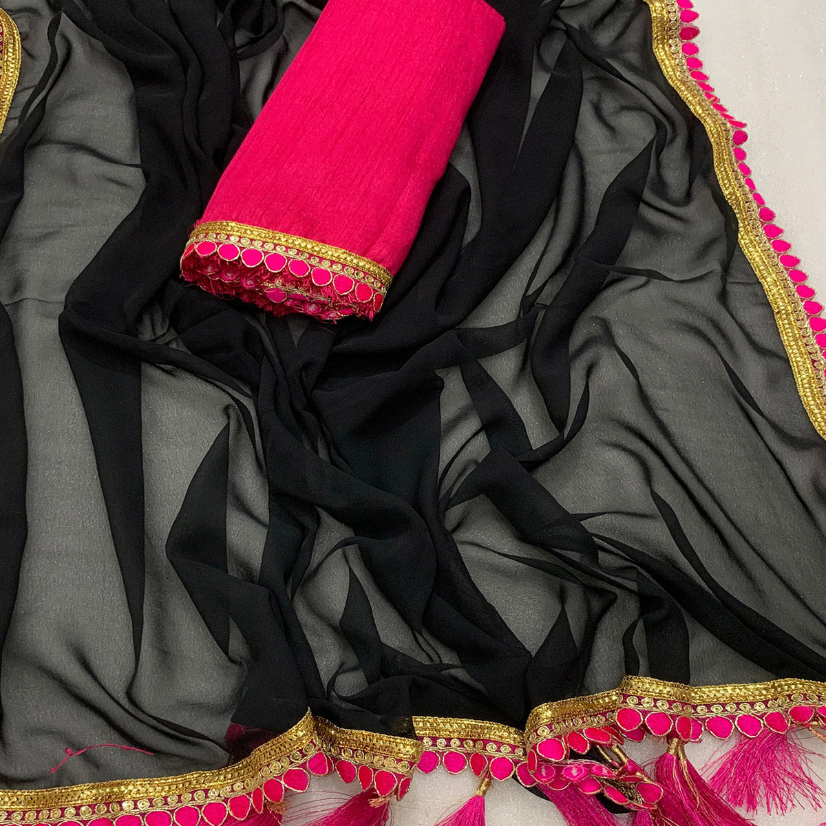 Black Solid Georgette Saree With Embroidered Lace Border Tassels