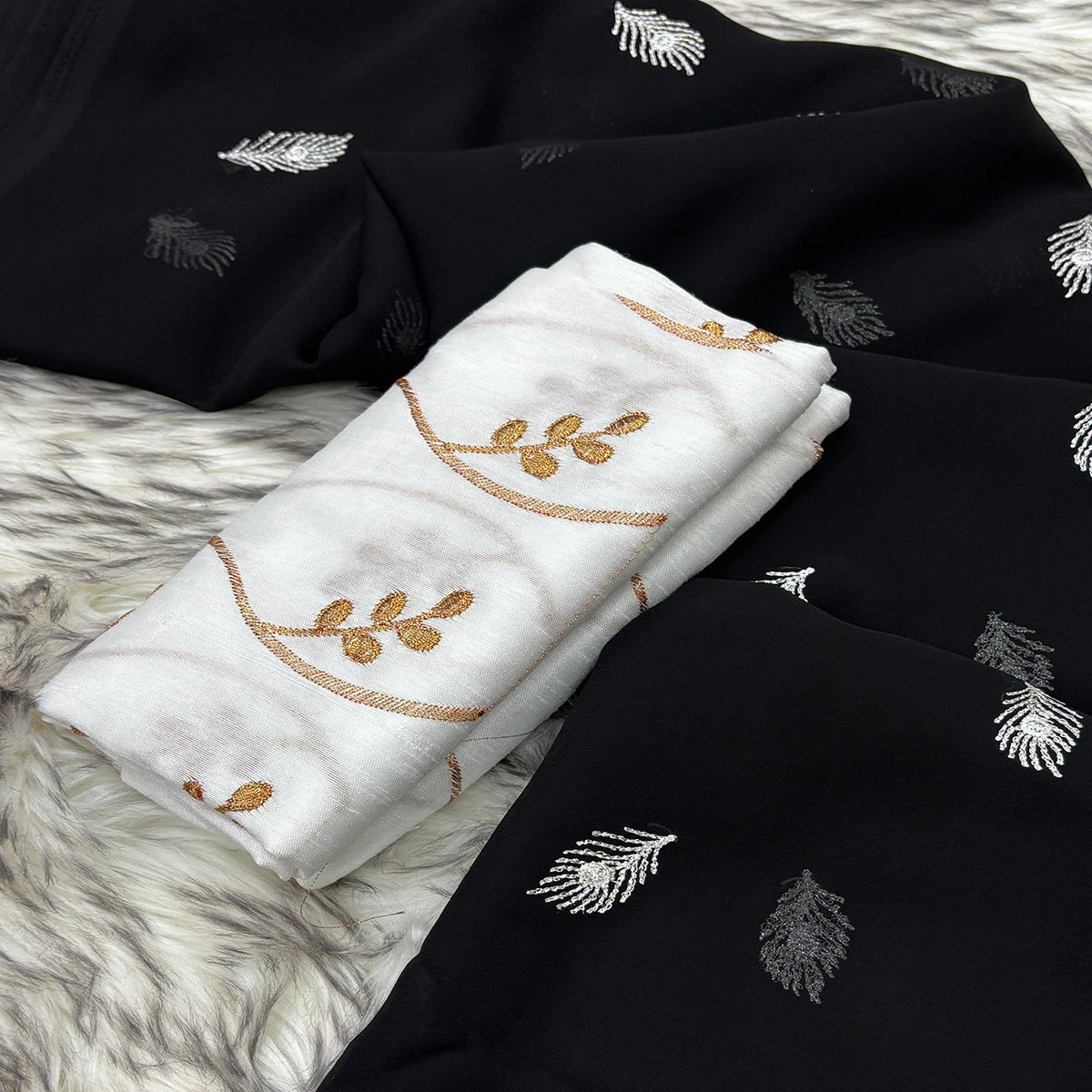 Black Embroidered Georgette Saree With Tassels