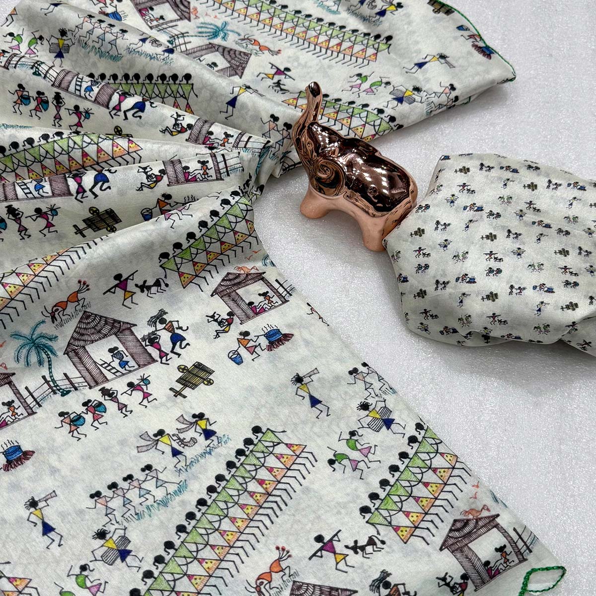 Sophisticated Off White Dola Silk Saree Adorned with Traditional Warli Patterns