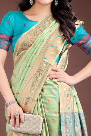 Harmonious Light Green Floral Zari Weaving Cotton Blend Saree with Graceful Tassels