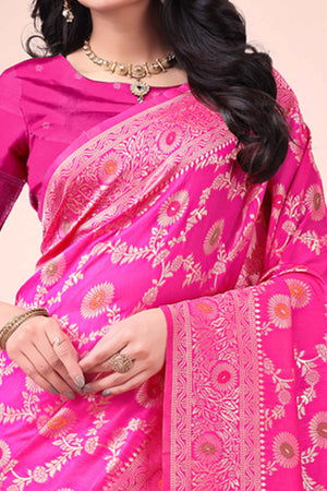 Rani Pink Banarasi Silk Saree With Intricate Floral Weave & Elegant Tassel Accents
