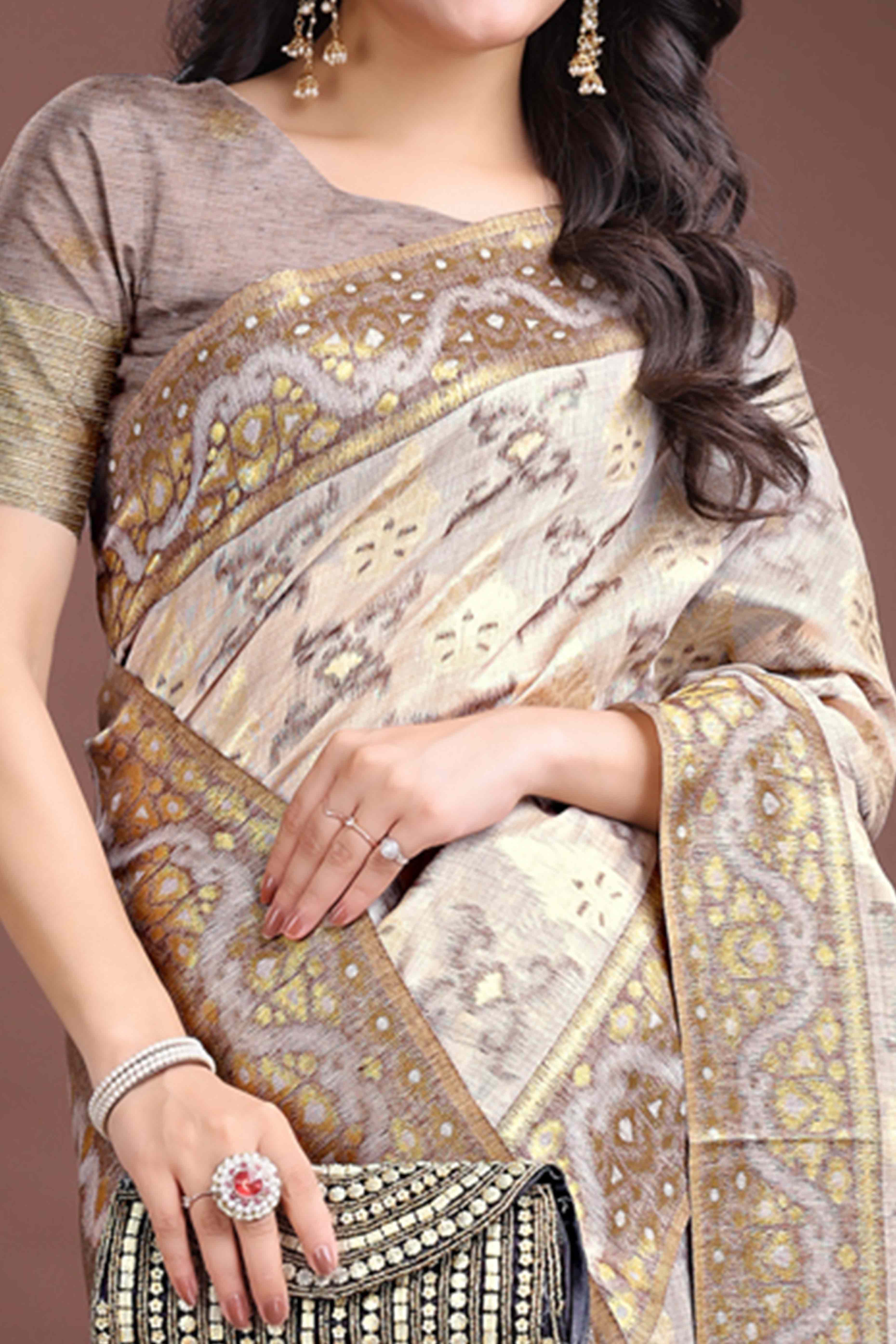 Sophisticated Brown Traditional Ikkat Style Zari Weaving Cotton Blend Saree Adorned with Elegant Tassels