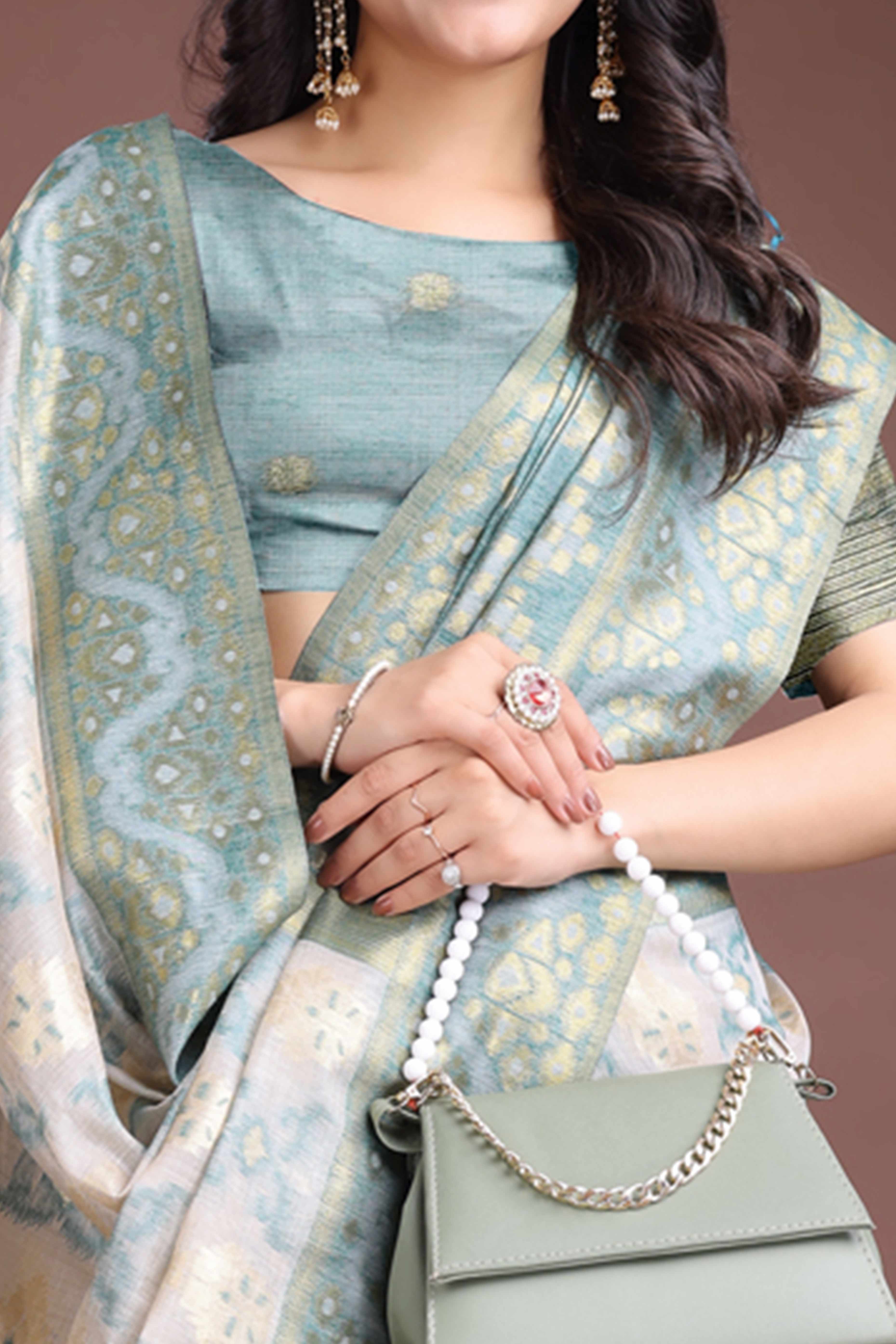 Serene Sea Green Traditional Ikkat Style Zari Weaving Cotton Blend Saree with Artistic Tassel Details