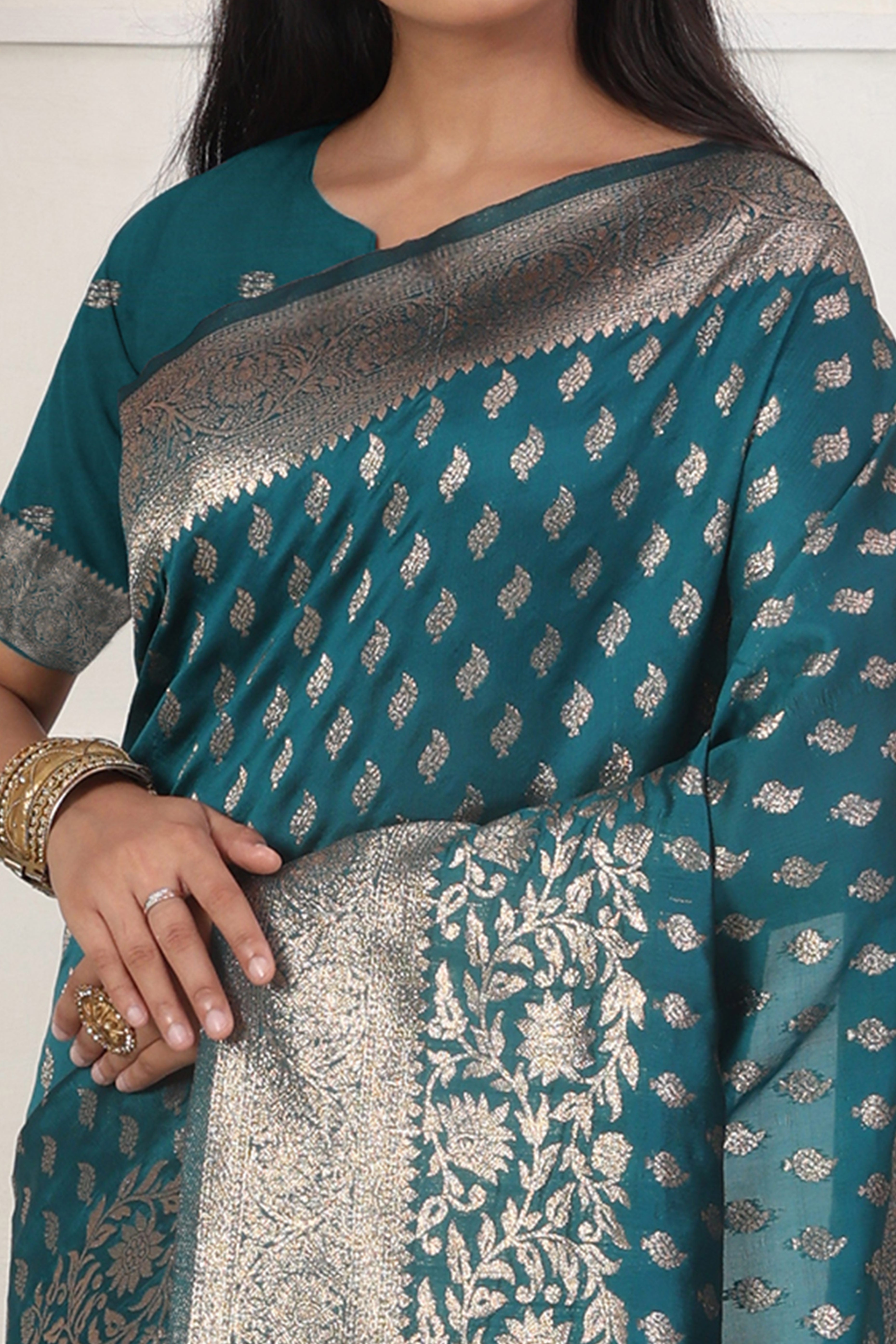 Rama Blue Traditional Lichi Silk Blend Saree Enhanced With Floral Zari Weaving & Tassel Pallu