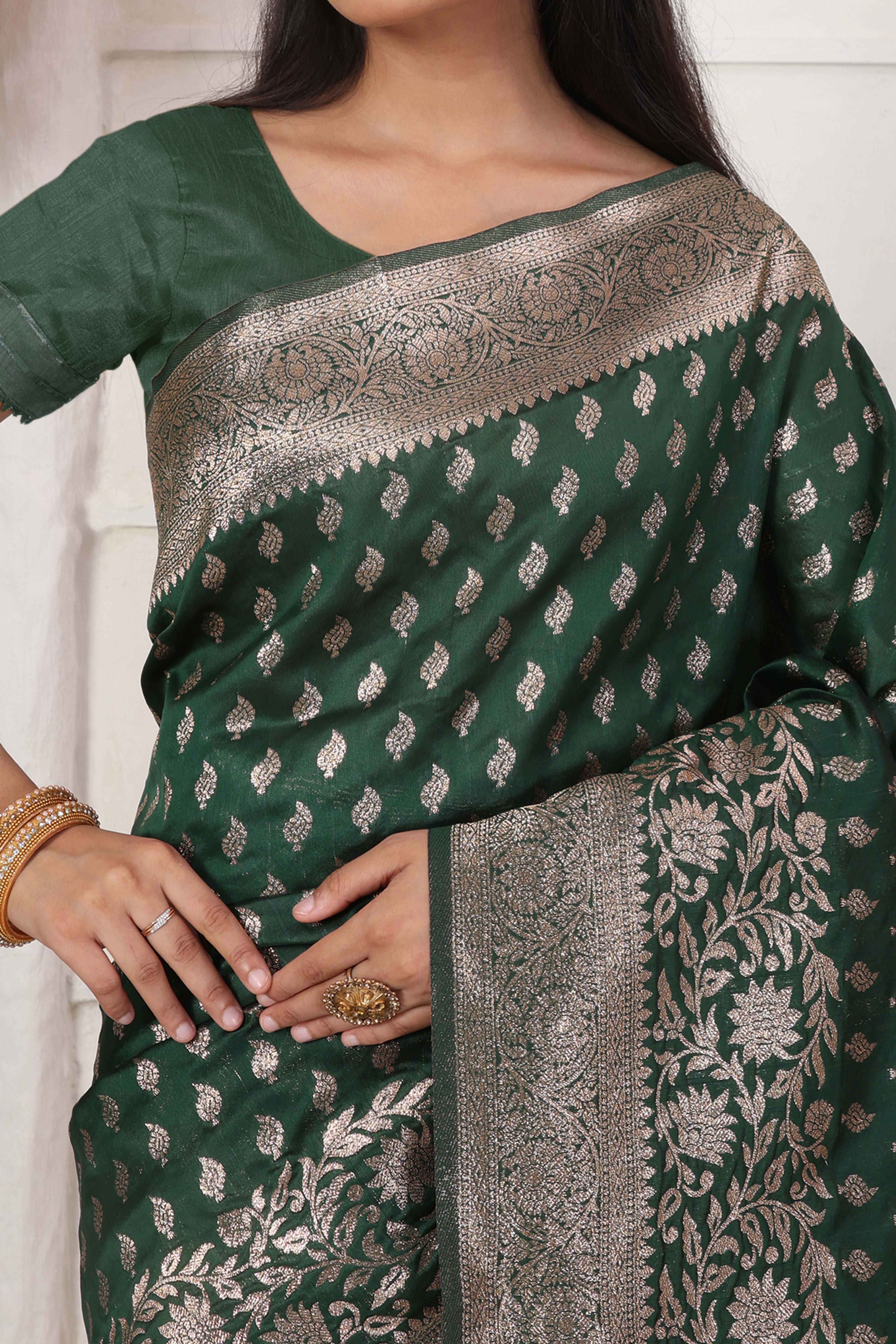 Green Traditional Lichi Silk Blend Saree Enhanced With Floral Zari Weaving & Tassel Pallu