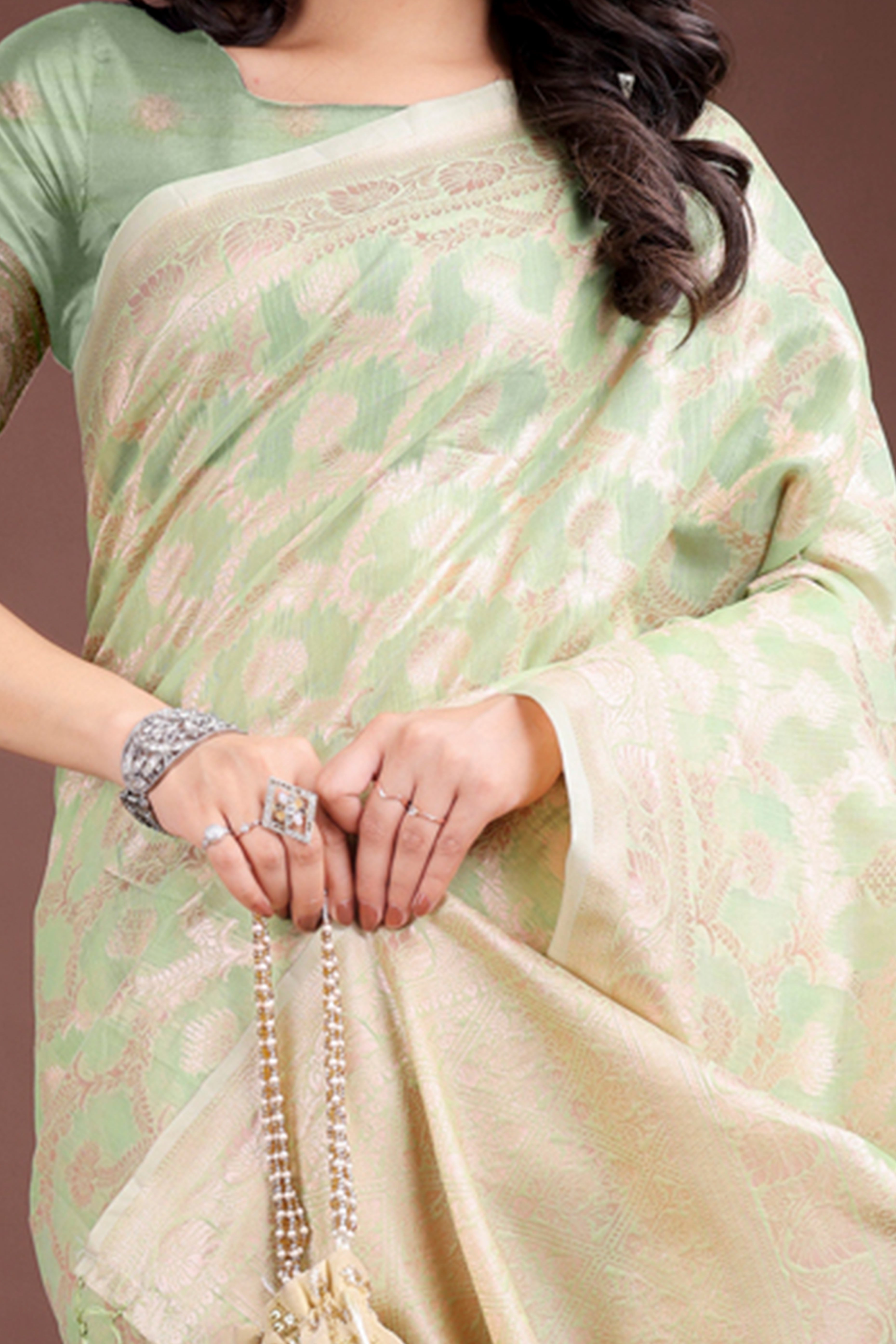 Light Green Linen Cotton Saree with Lustrous Zari Borders and Elegant Tassel Accents