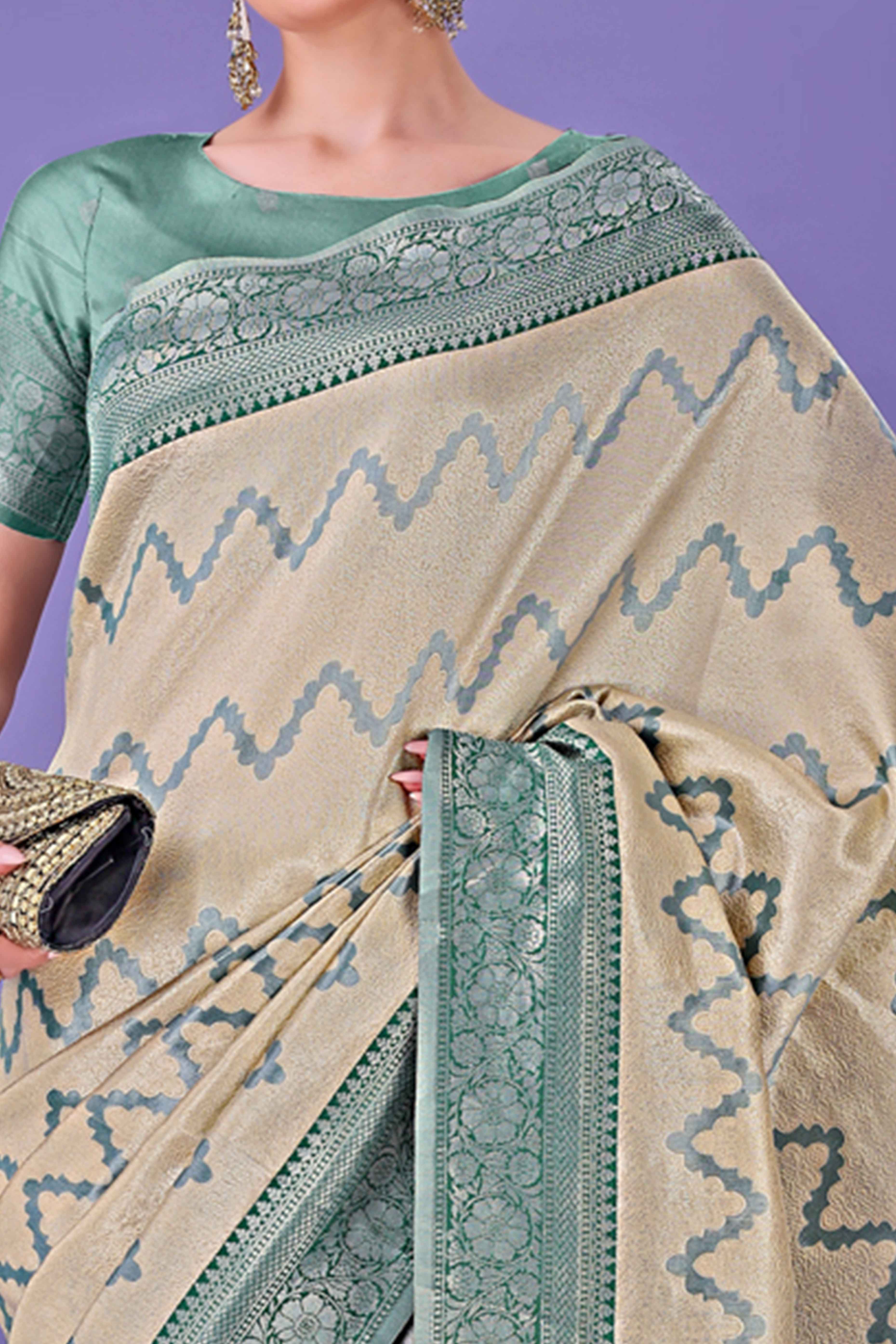 Cream Lichi Cotton Silk Saree Adorned With Floral Zari Weave & Tassels