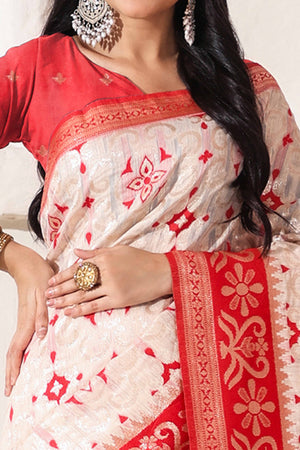 White & Red Linen Cotton Saree Adorned With Intricate Zari Weaving And Tassel Pallu