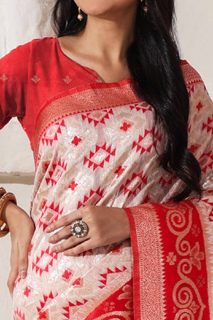 White & Red Linen Cotton Saree Featuring Fine Zari Weaving And A Tasselled Finish