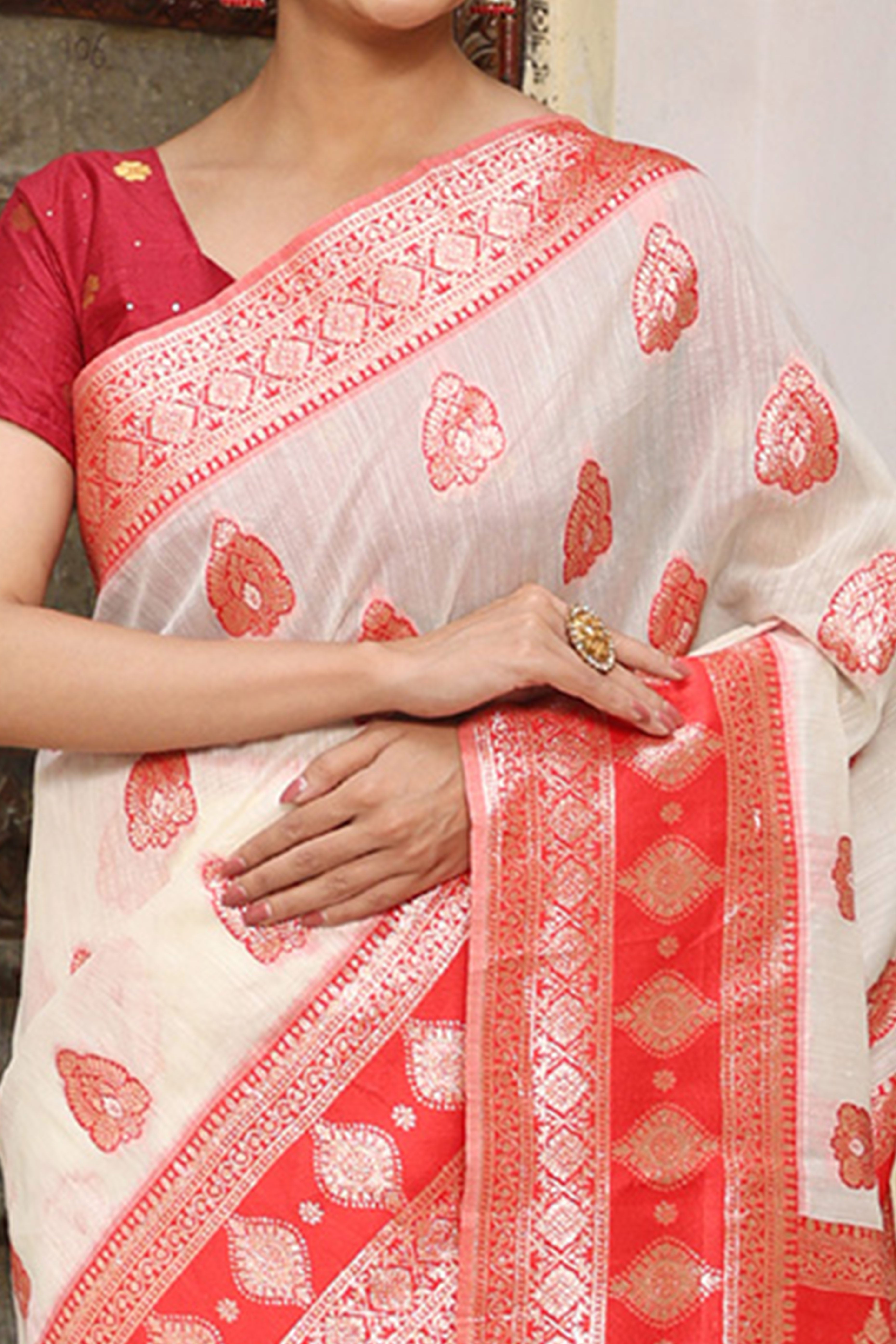 Elegant White Saree in Linen Cotton Fabric Adorned with Red Border and Zari Weaving