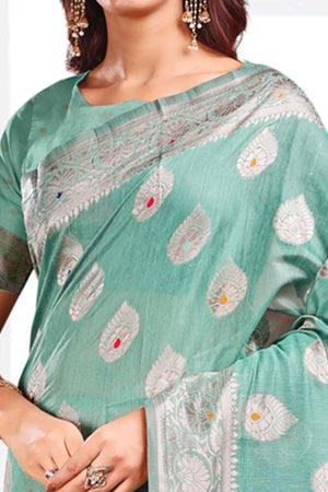 Turquoise Linen Cotton Silk Saree Adorned With Intricate Floral Zari Weaving & Tassel Pallu
