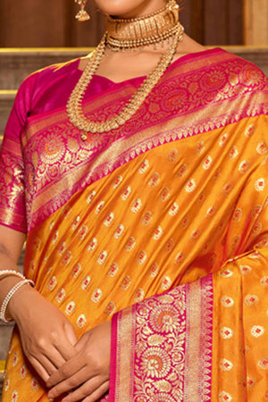 Orange Banarasi Silk Saree Featuring Intricate Floral Weaving & Elegant Tassel Pallu