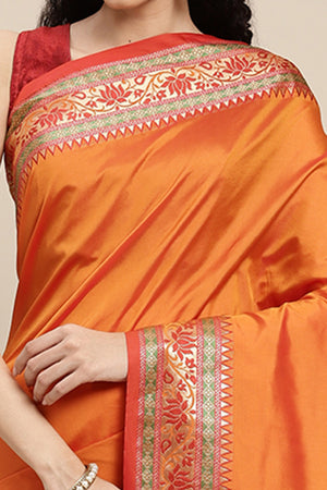 Graceful Orange Solid Saree Highlighted With Floral Zari Weaving On Silk Blend & Tassel Pallu