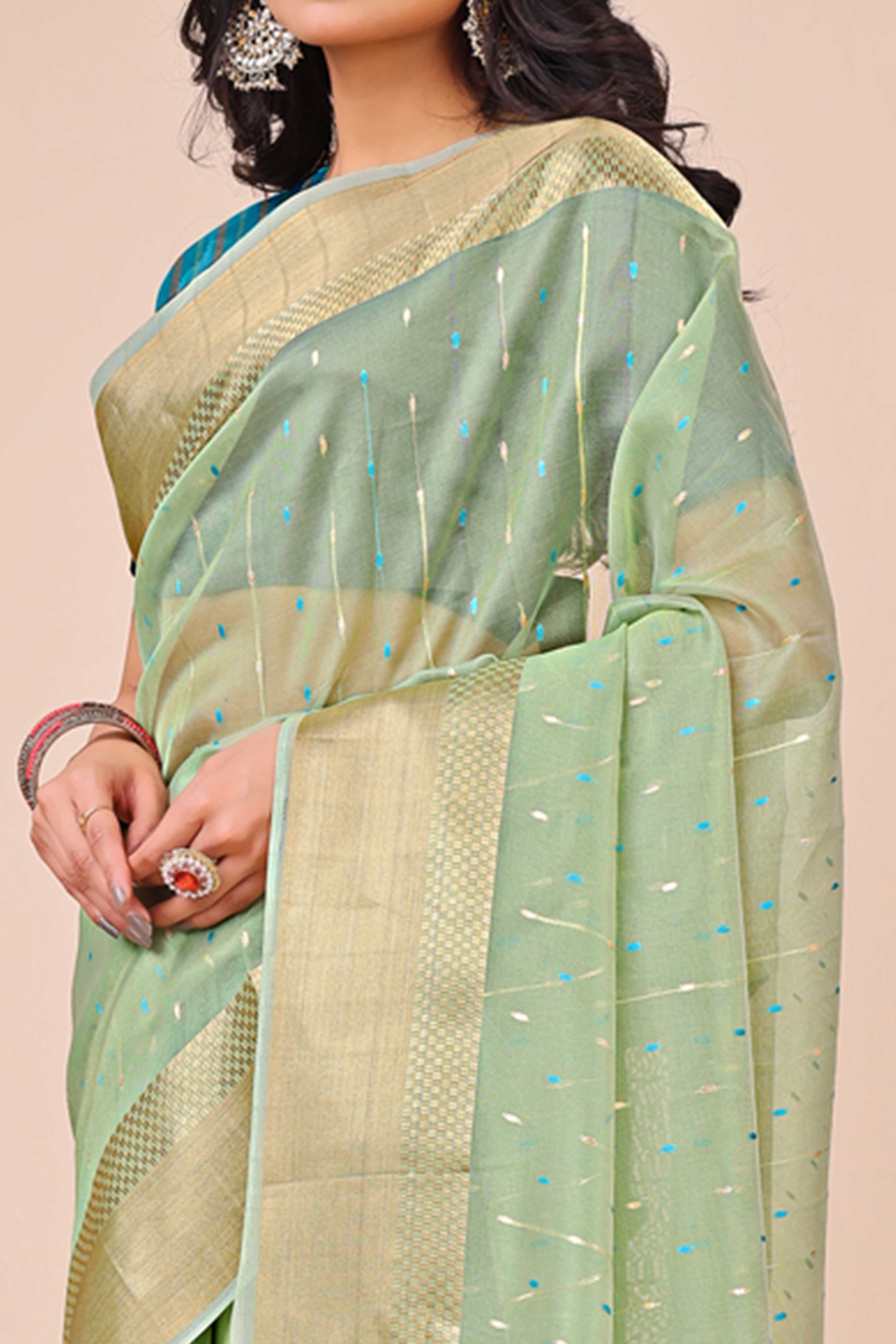 Pista Green Organza Saree Adorned With Fine Zari Weaving & Stylish Tassel Edging