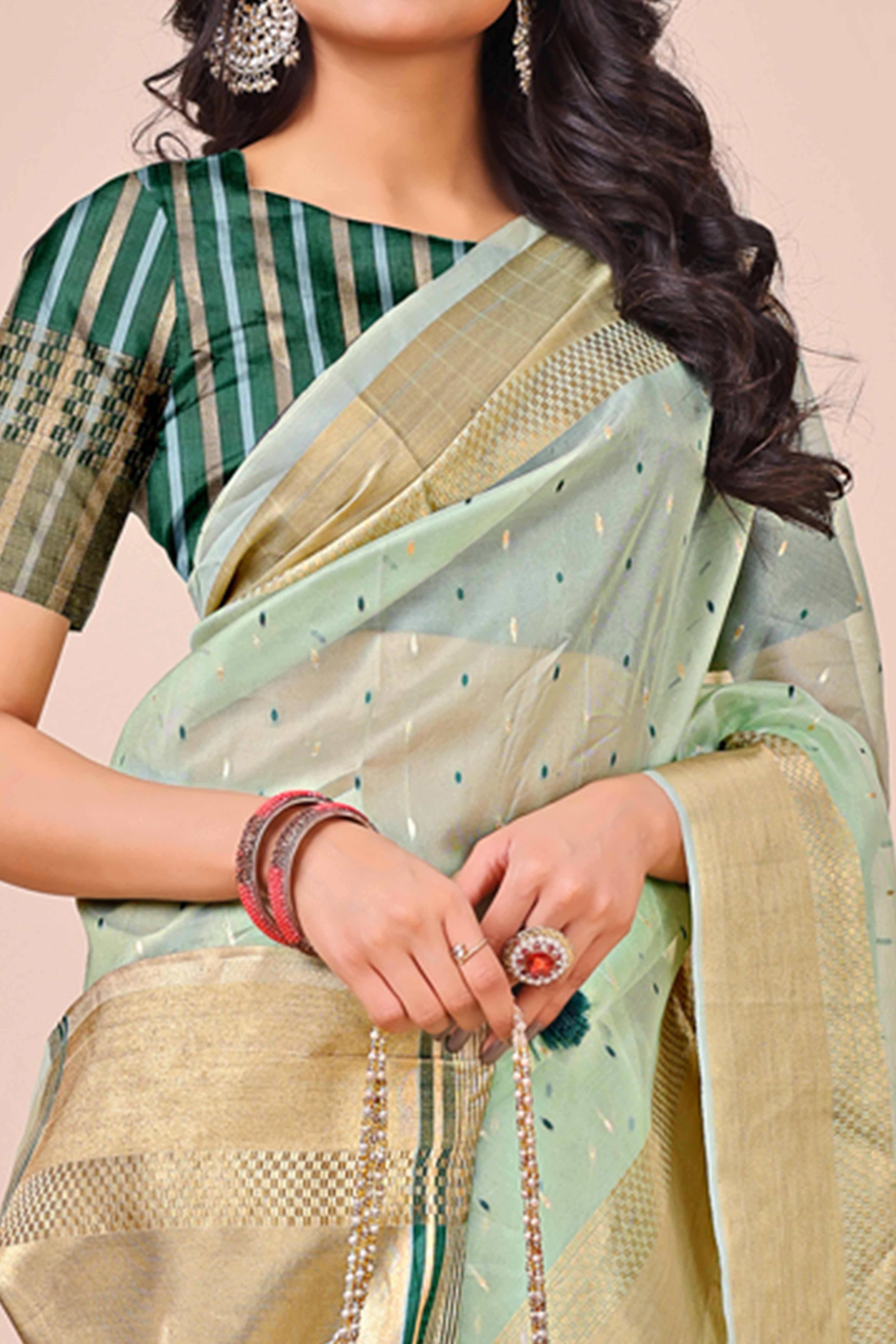 Sea Green Organza Saree Adorned With Fine Zari Weaving & Stylish Tassel Edging