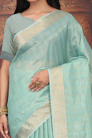 Turquoise Organza Saree Adorned With Floral Zari Weaving & Graceful Tassel Pallu