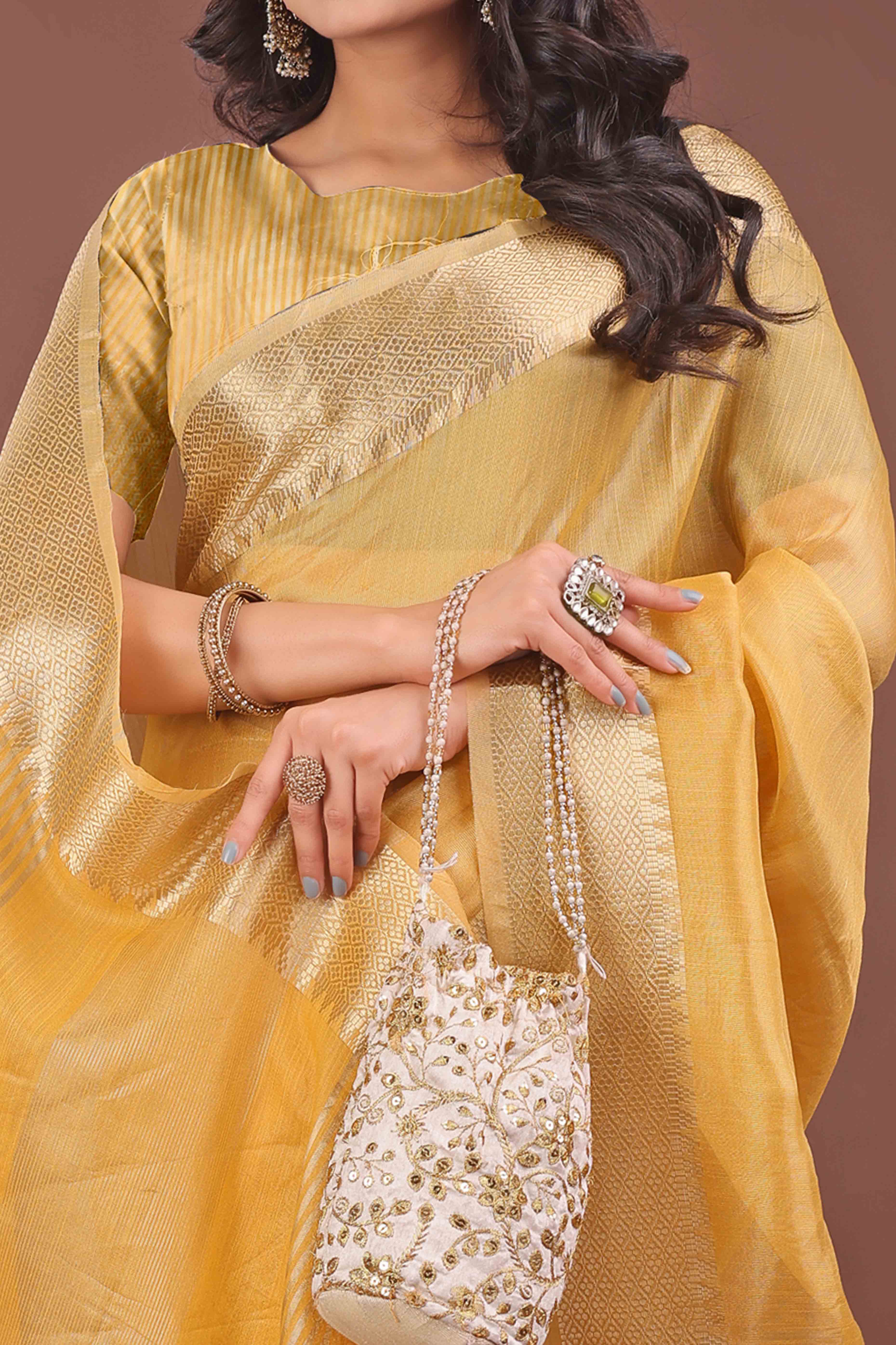 Yellow Solid With Zari Woven Organza Saree With Tassel Border
