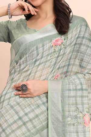 Sea Green Linen Cotton Saree Featuring Floral Prints & Woven Border