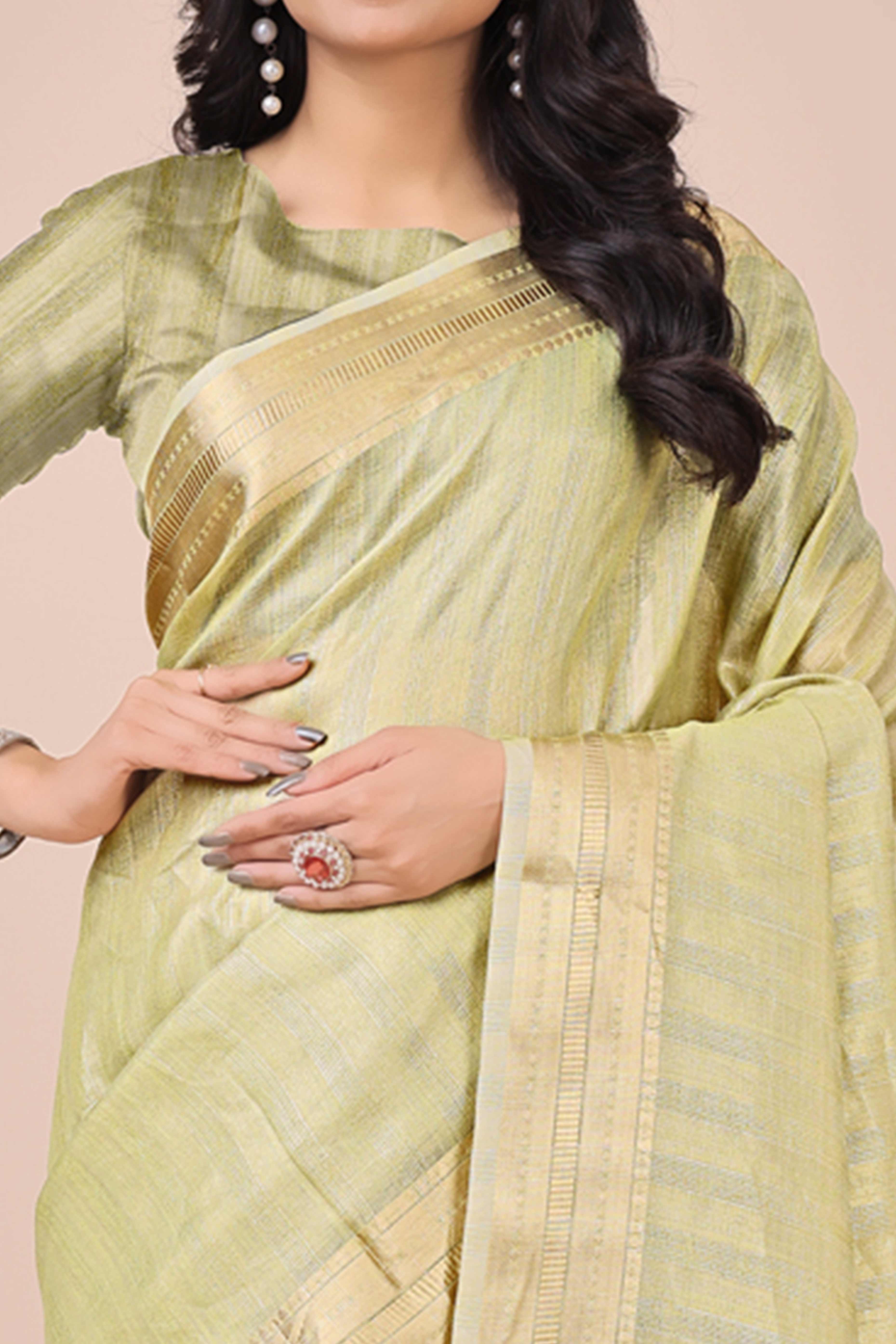 Light Green Organza Saree With Intricate Weave & Elegant Tassel Accents