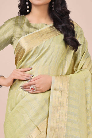 Light Green Organza Saree With Intricate Weave & Elegant Tassel Accents