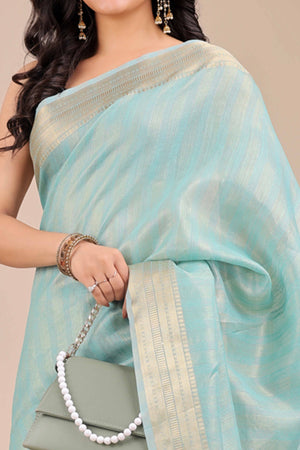 Light Turquoise Organza Saree With Intricate Weave & Elegant Tassel Accents