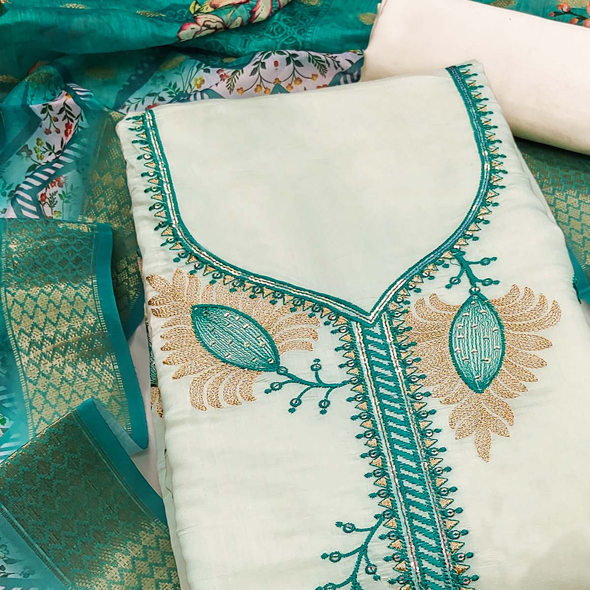 Elegant Cream & Turquoise Floral Embroidered Roman Cotton Silk Dress Material With Sequins Work