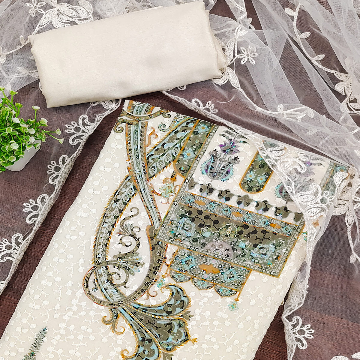 Cream And Green Schiffli Embroidered Heavy Georgette Dress Material