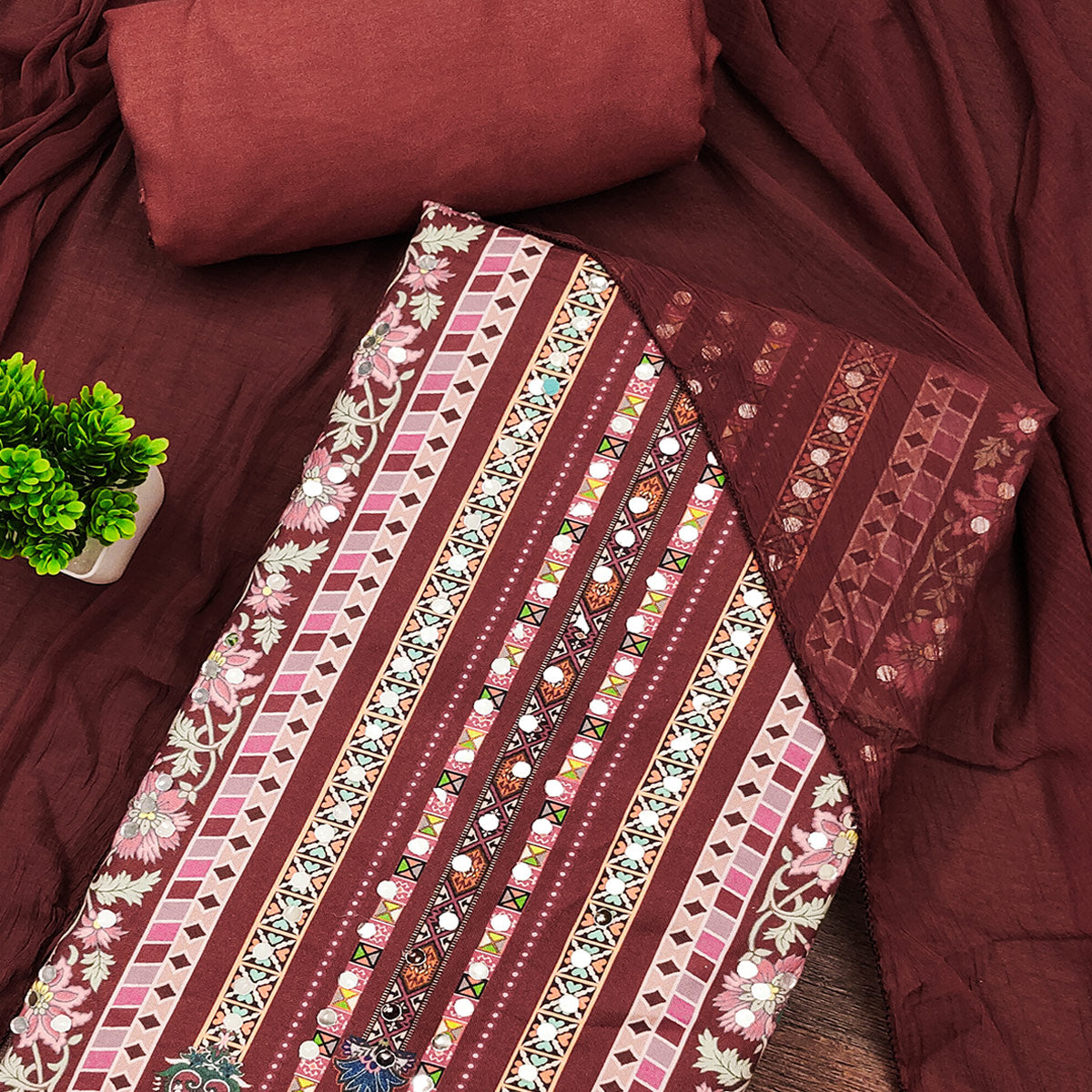 Rust Paisley & Floral Digital Printed Rayon Dress Material With Intricate Mirror Work