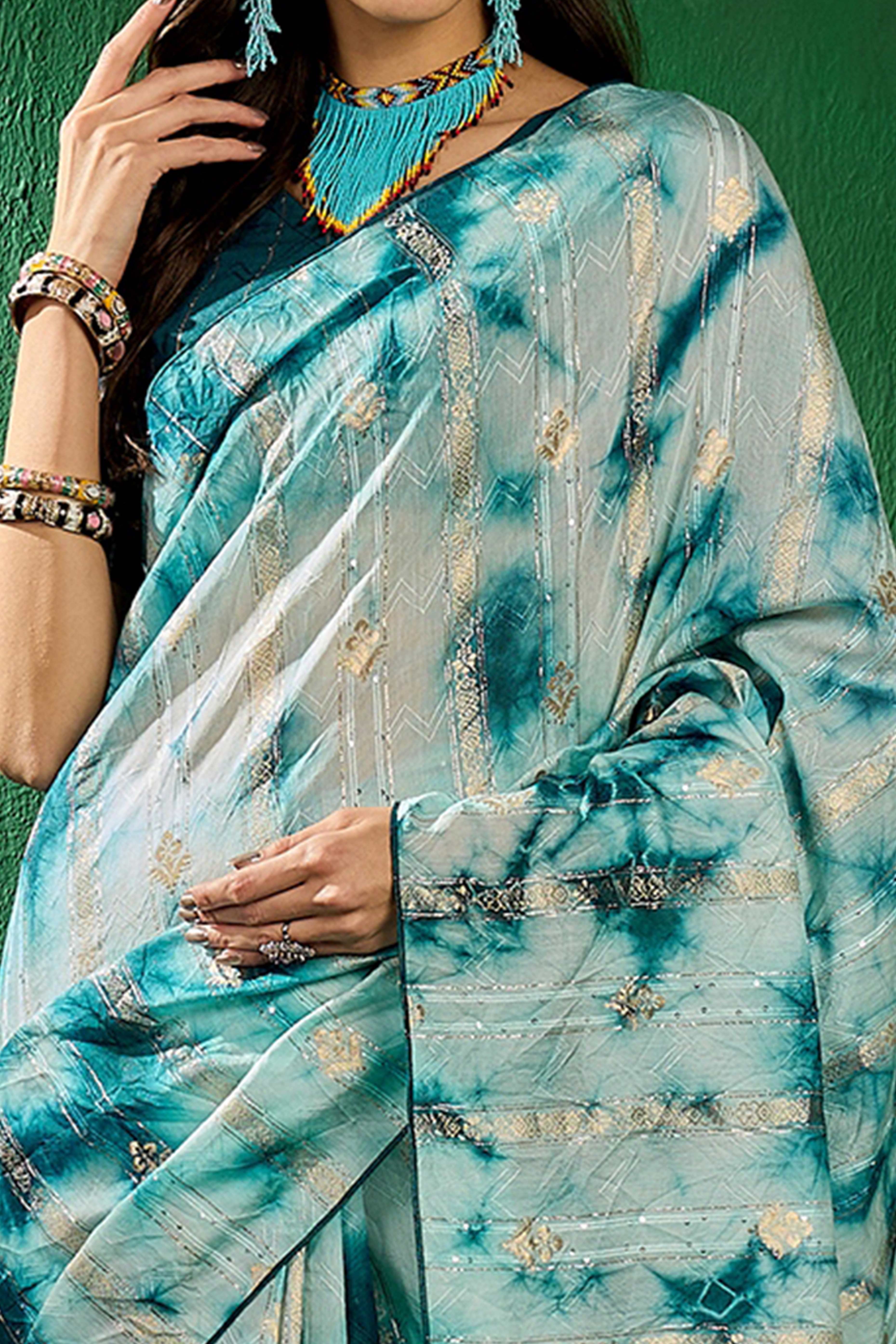 Floral Zari Woven Teal Saree In Cotton Blend With Sparkling Sequins & Elegant Tassel Pallu