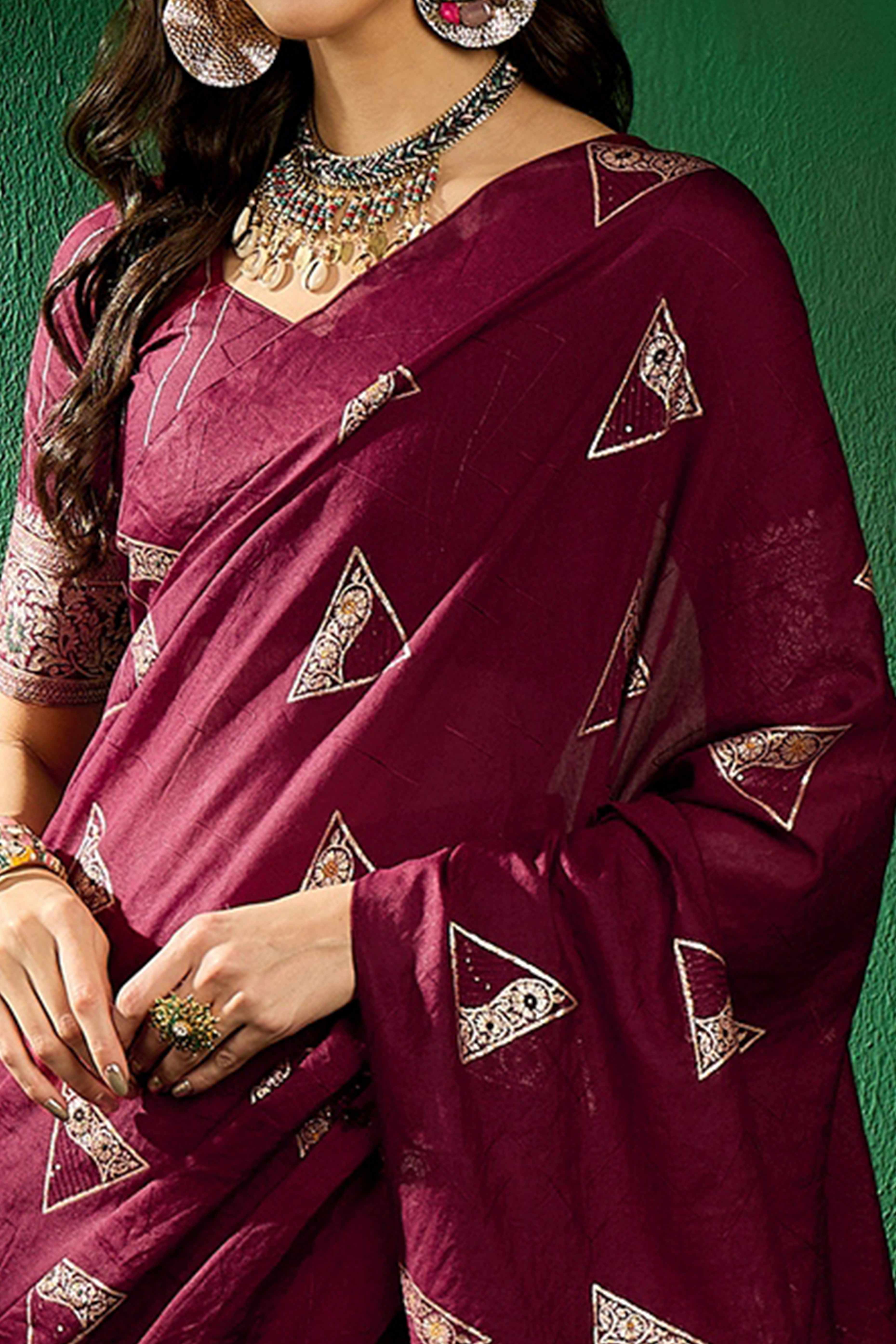 Wine Floral Woven Staple Cotton Blend Saree With Sparkling Sequin Embroidery & Graceful Tassel Pallu