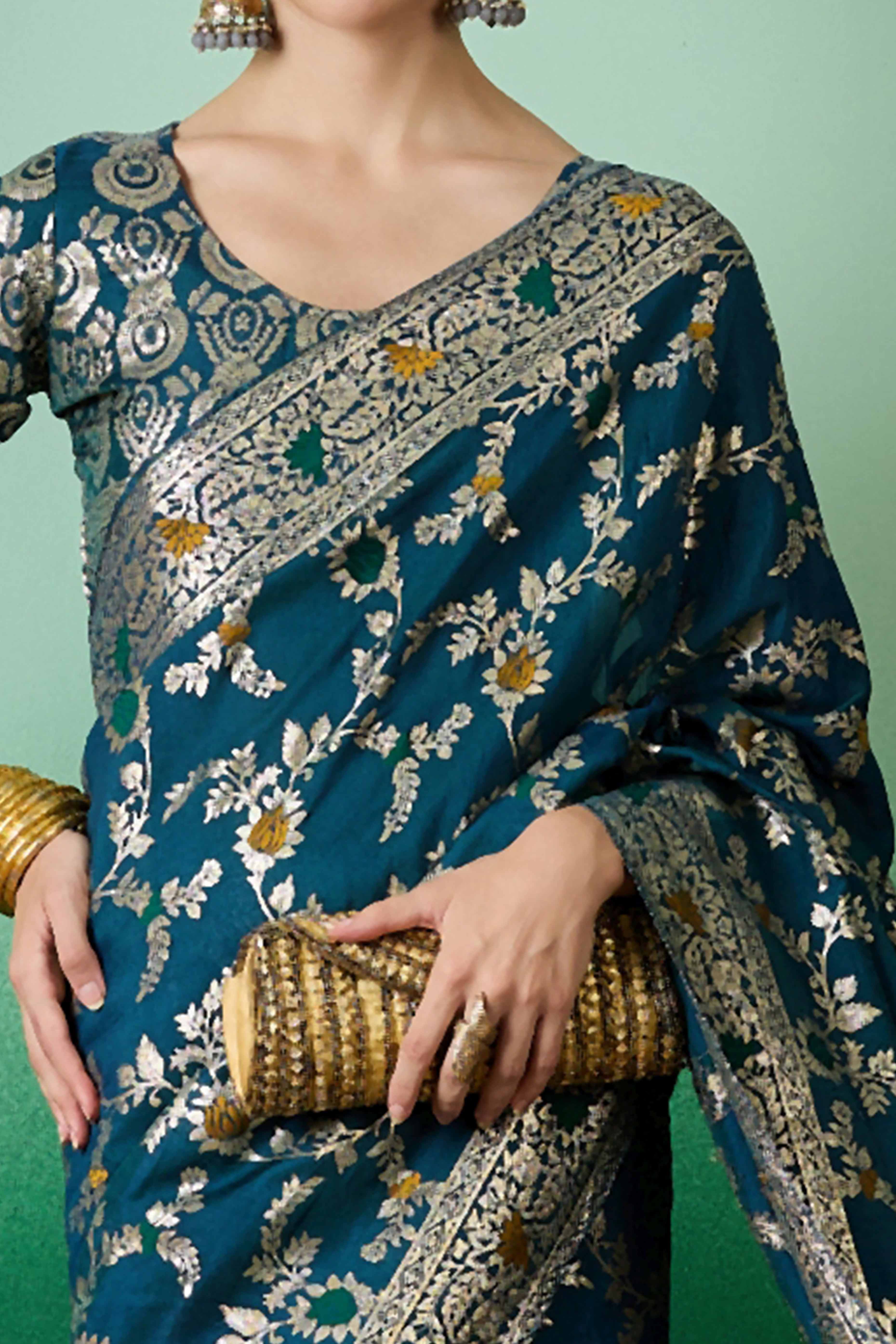 Teal Cotton Meena jacquard Saree Featuring Intricate Floral Weaving & Tassels On The Pallu