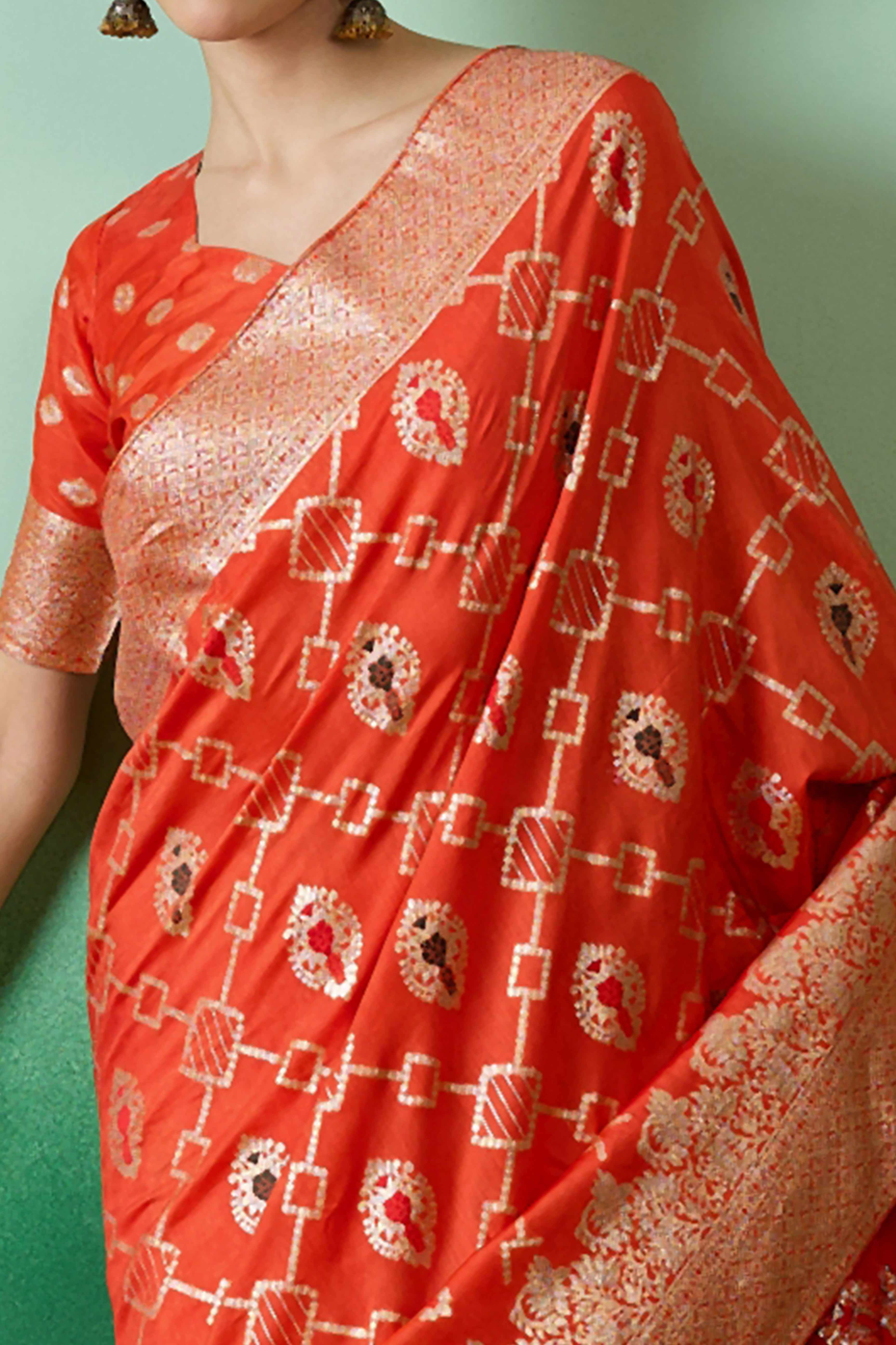 Orange Zari Woven Staple Cotton Blend Saree With Floral Motifs & Tassel Detailed Pallu