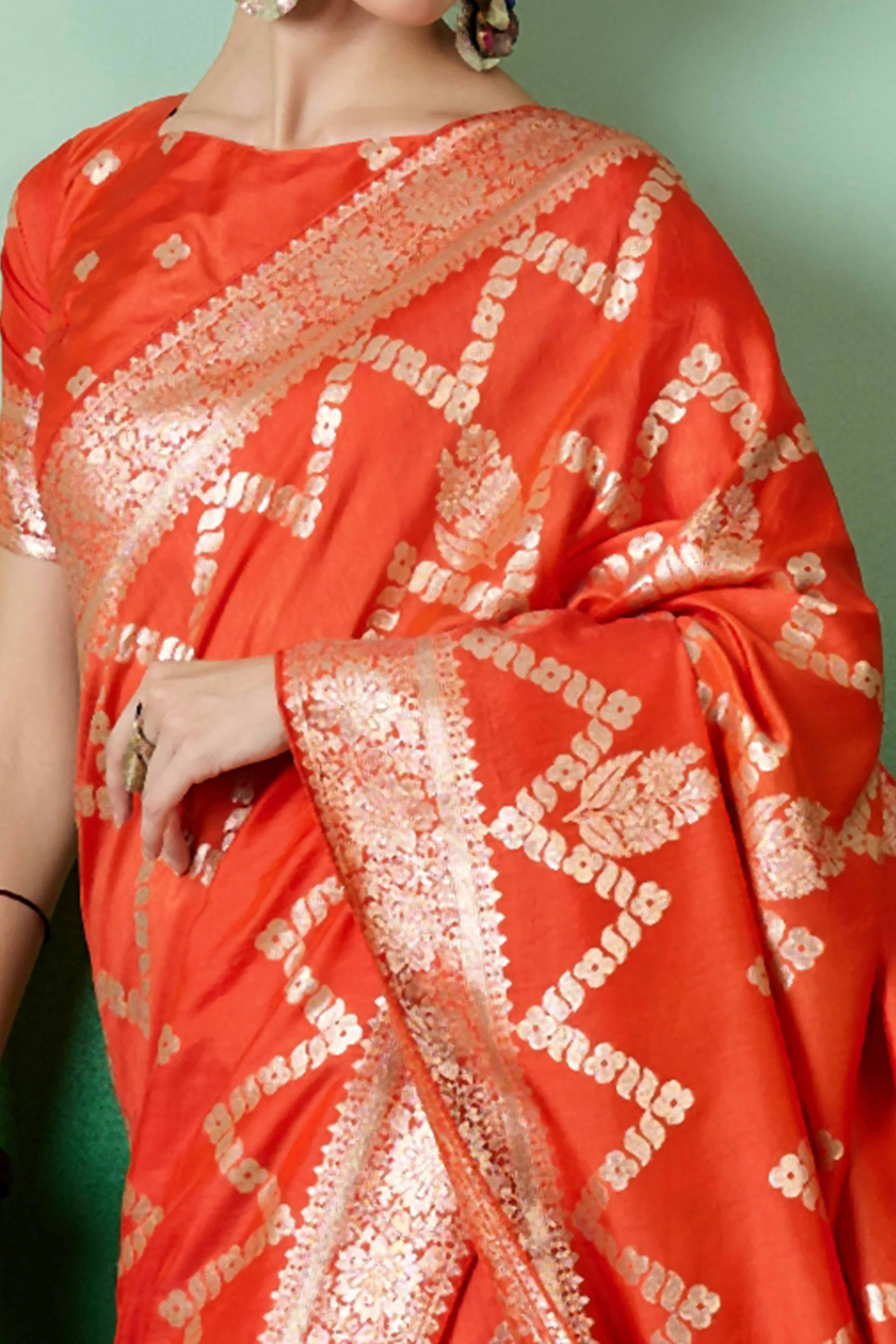 Orange Cotton Blend Jacquard Saree Adorned With Floral Weaving & Graceful Tassel Pallu