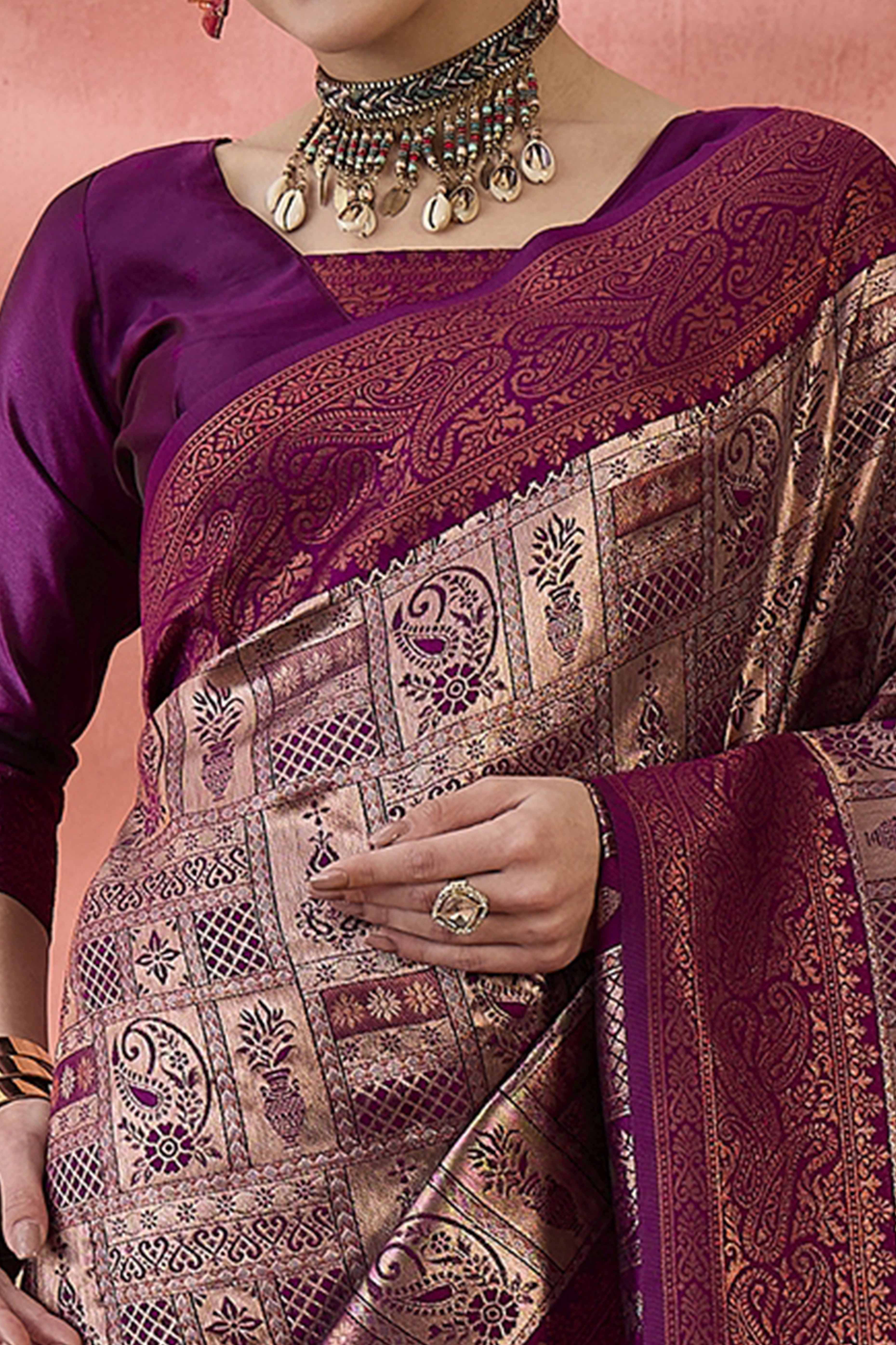 Wine Woven Poly Silk Blend Saree Featuring Floral & Paisley Motifs With Tassel Accents