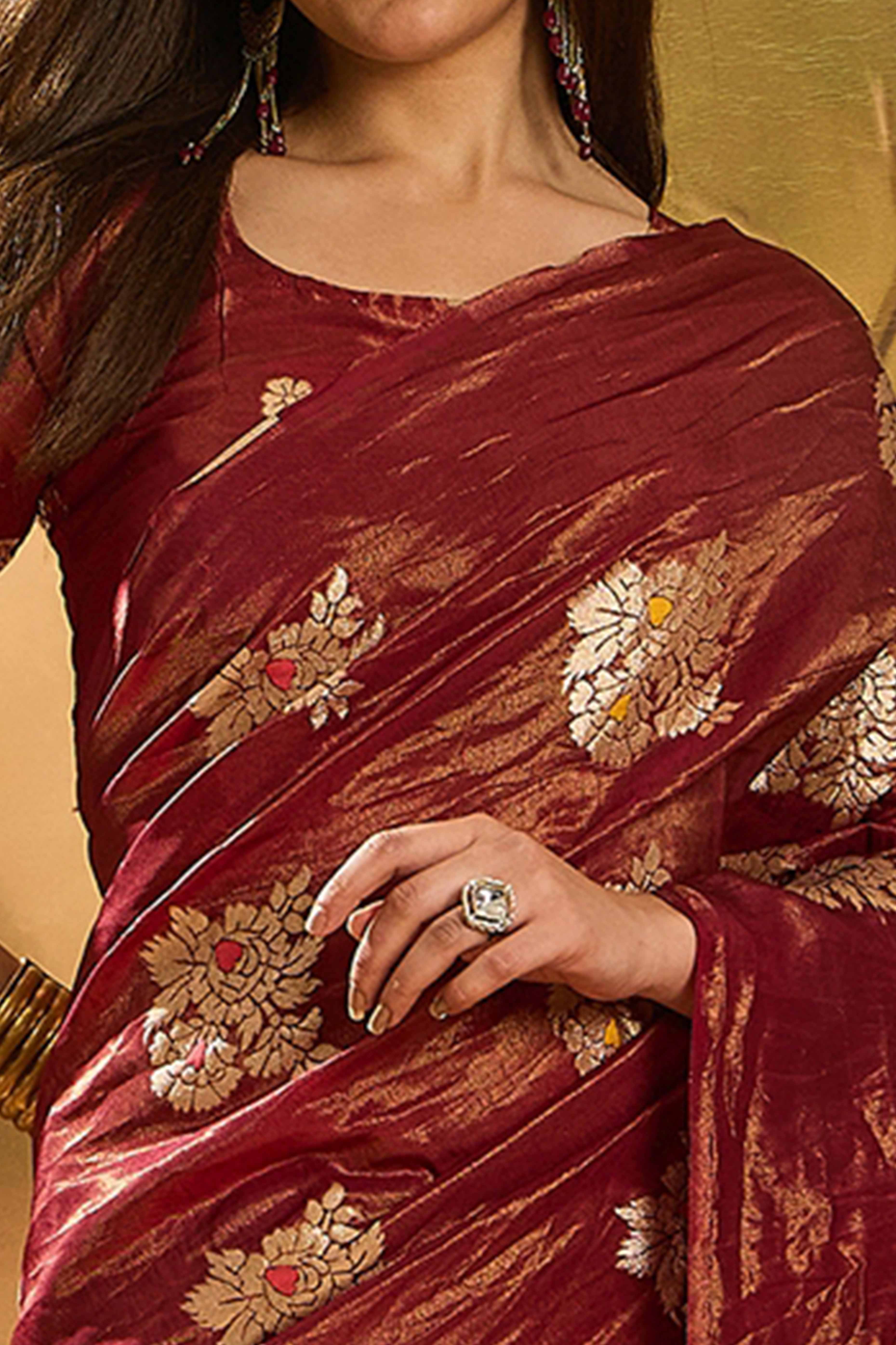 Maroon Saree In Shimmer Fabric With Floral Zari Weaving & Decorative Tassel Pallu