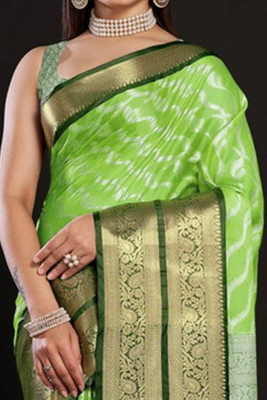 Parrrot Green Kanjivaram Silk Saree Adorned With Zari Weaving & Graceful Tassels