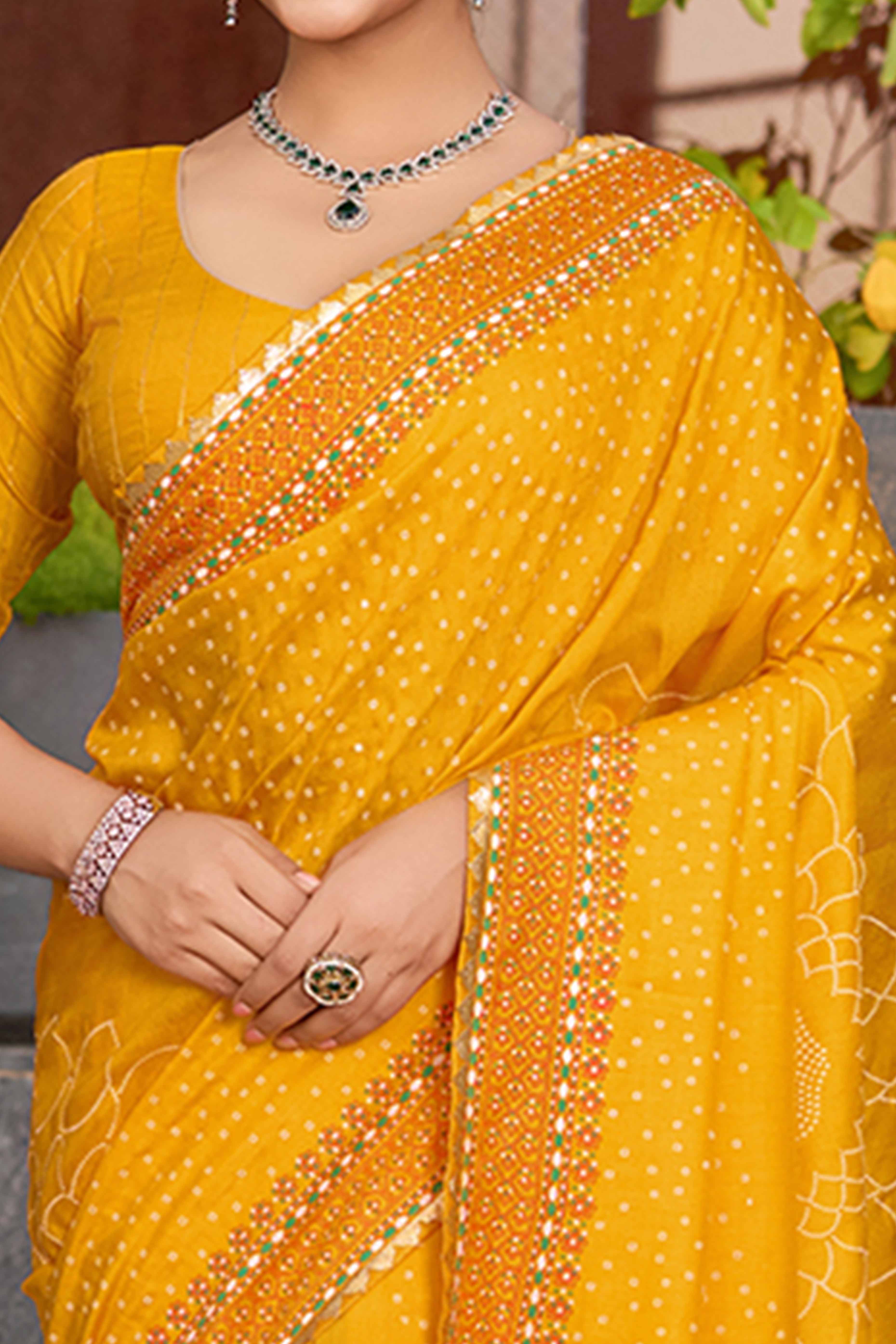 Feel The Luxury Of Mustard Bandhani Foil Printed Cotton Silk Sarree With Lace Border