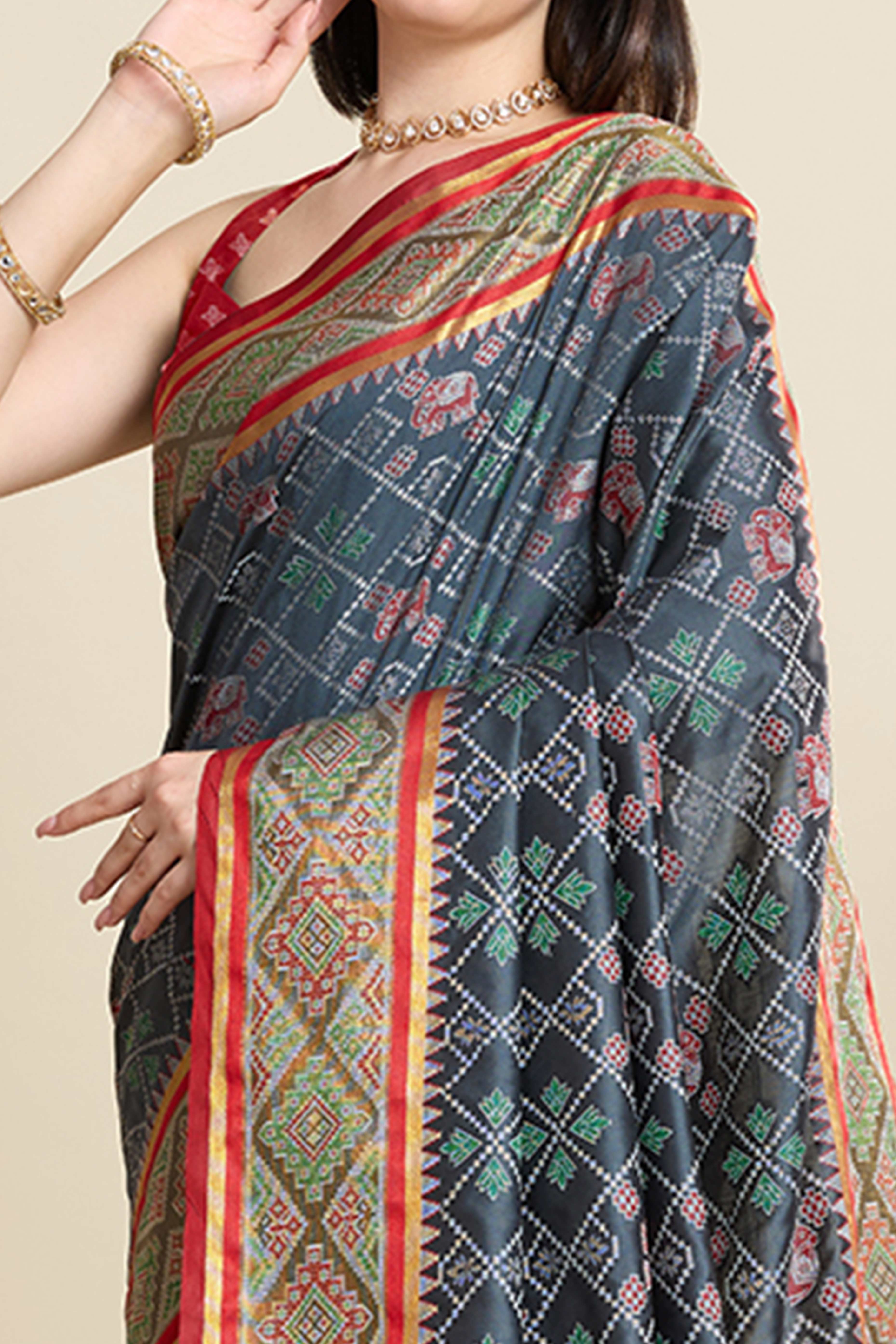 Grey Silk Blend Saree Featuring Patola Prints and a Detailed Weaving Border