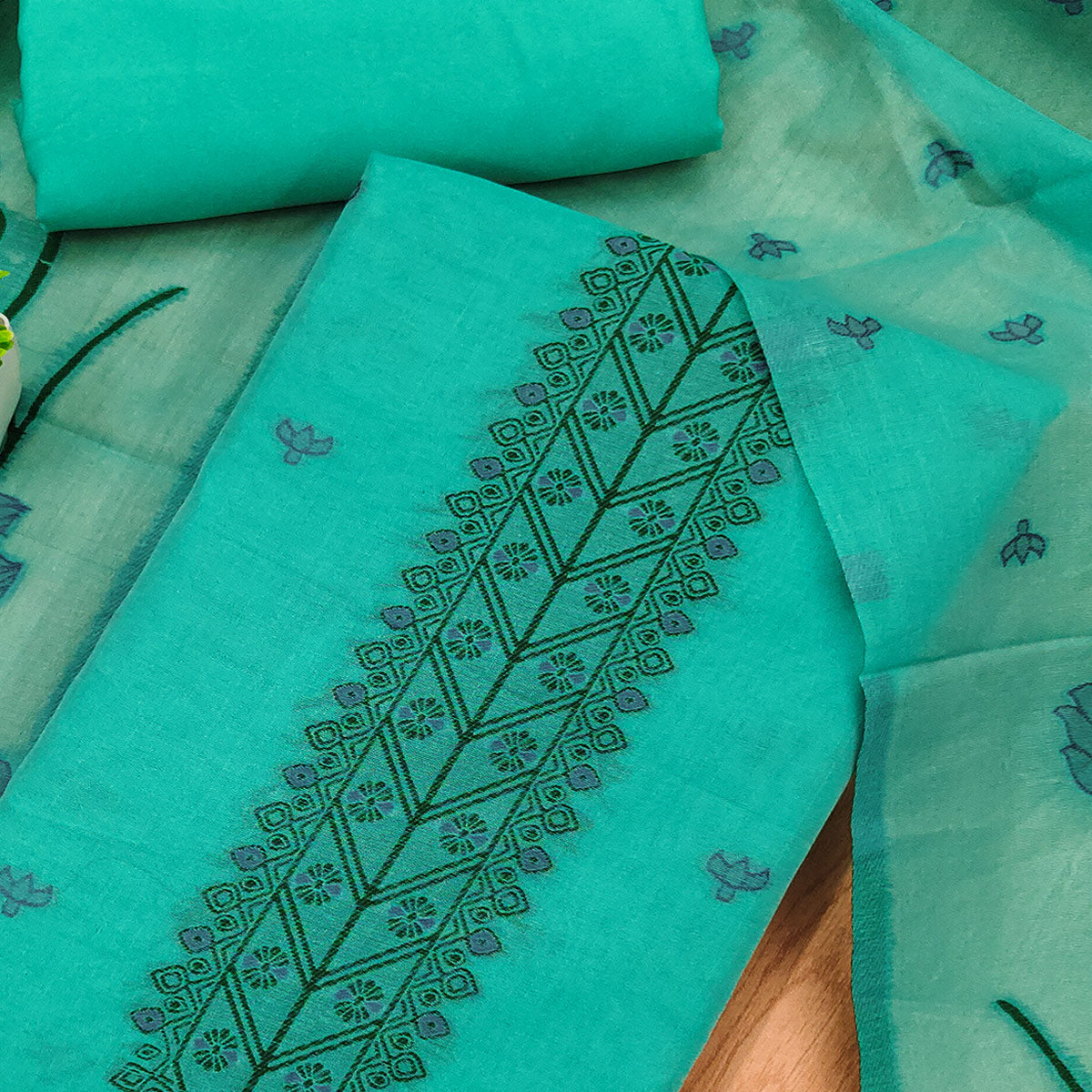 Sea Green Ethnic Dress Material Showcasing Handloom Style Floral Zari Weaving